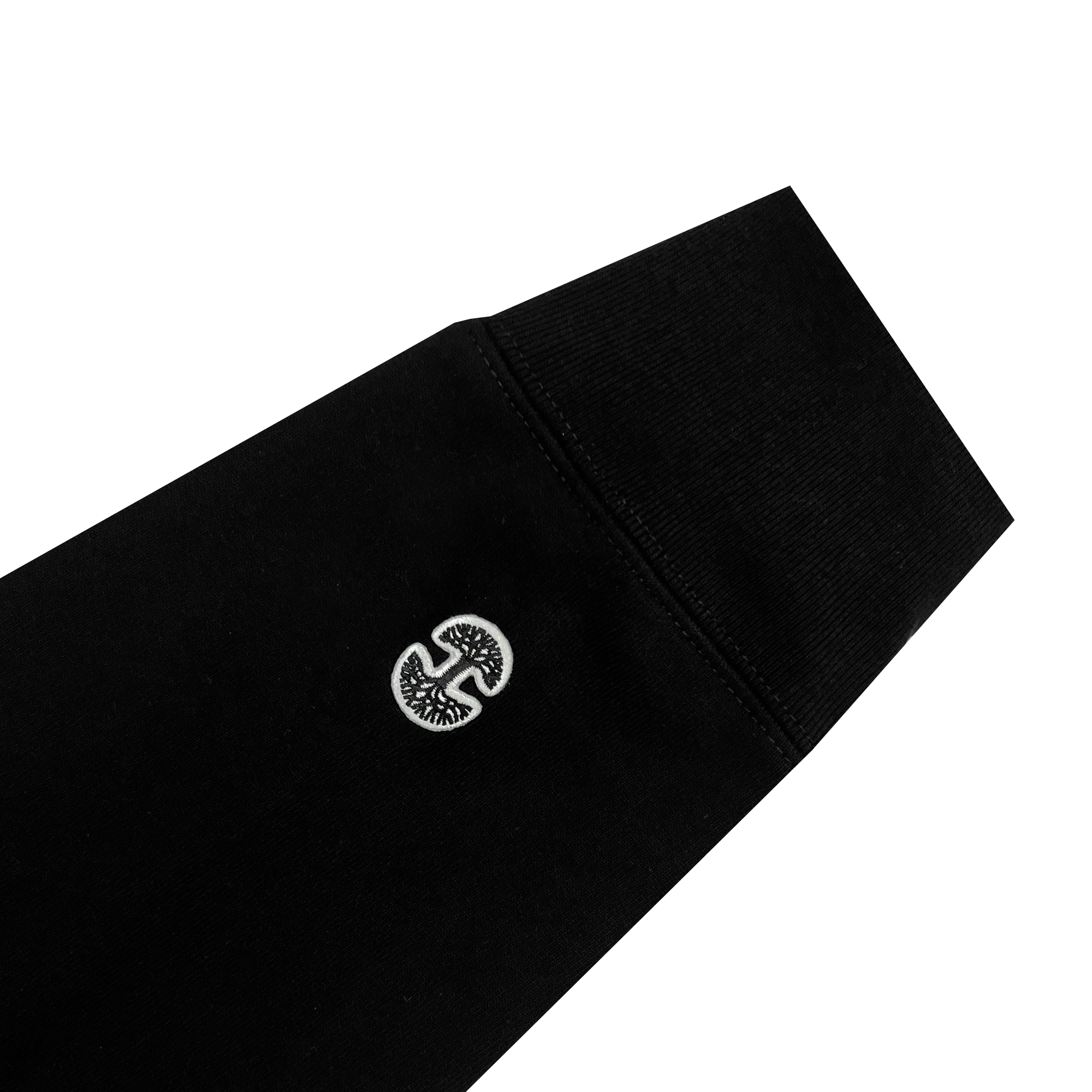 Detailed view of black pullover hoodie sleeve with mini woven Oaklandish tree logo near left cuff.