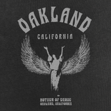 Detailed close-up of Oakland California graphic celebrating Isadora Duncan, pioneer of modern dance on a faded black cropped women’s t-shirt.