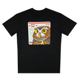 Backside view of a black t-shirt featuring a graphic with a Burrowing Owl designed by Oakland Artist Nite Owl on a USPS sticker.