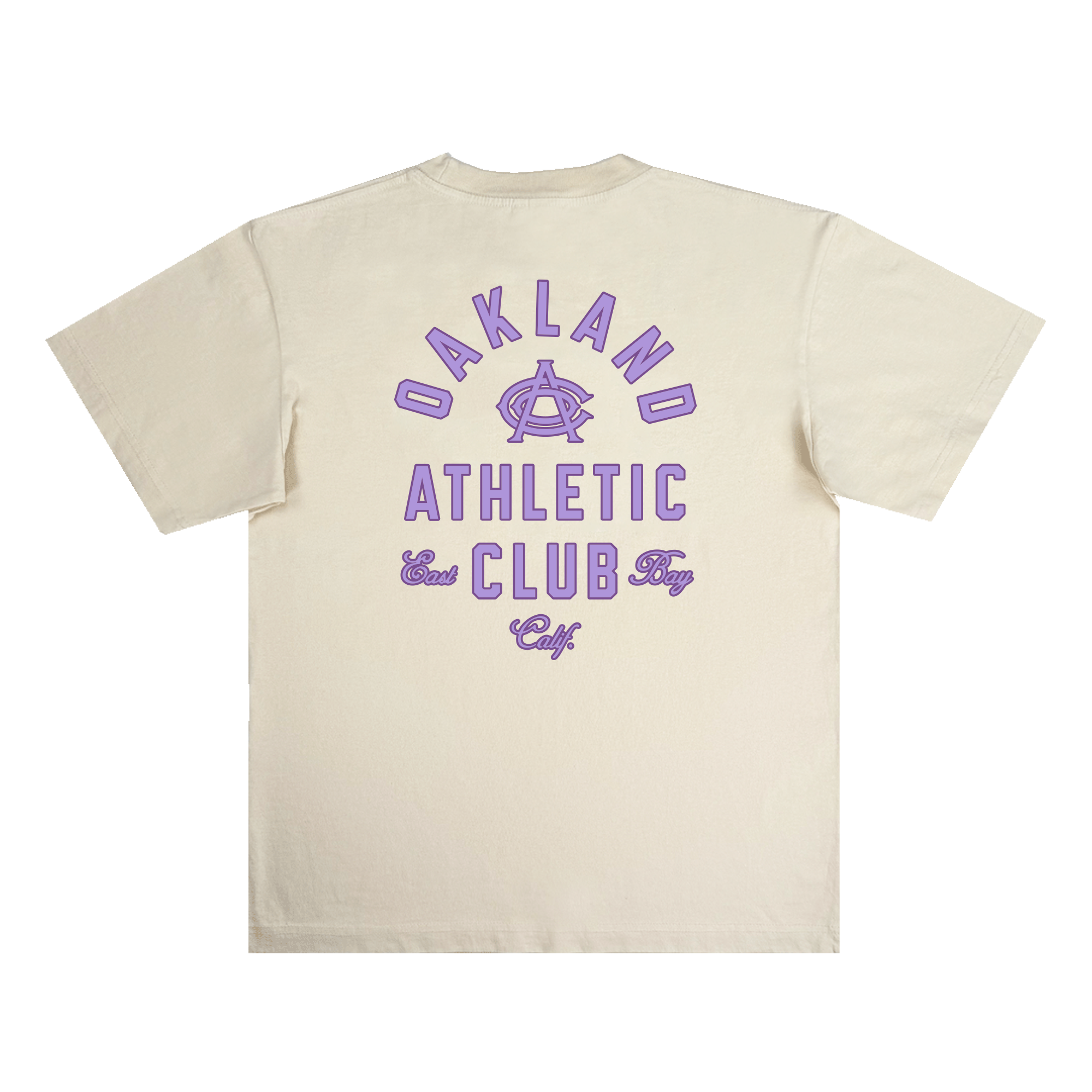 The OAC Tee by OAC is a beige, classic-fit t-shirt featuring bold purple text and graphics on the back. The design showcases “OAKLAND ATHLETIC CLUB East Bay Calif” with a stylized “A” logo at the center, all printed on heavyweight cotton for a vintage, athletic look. The shirt is displayed laid flat against a white background.