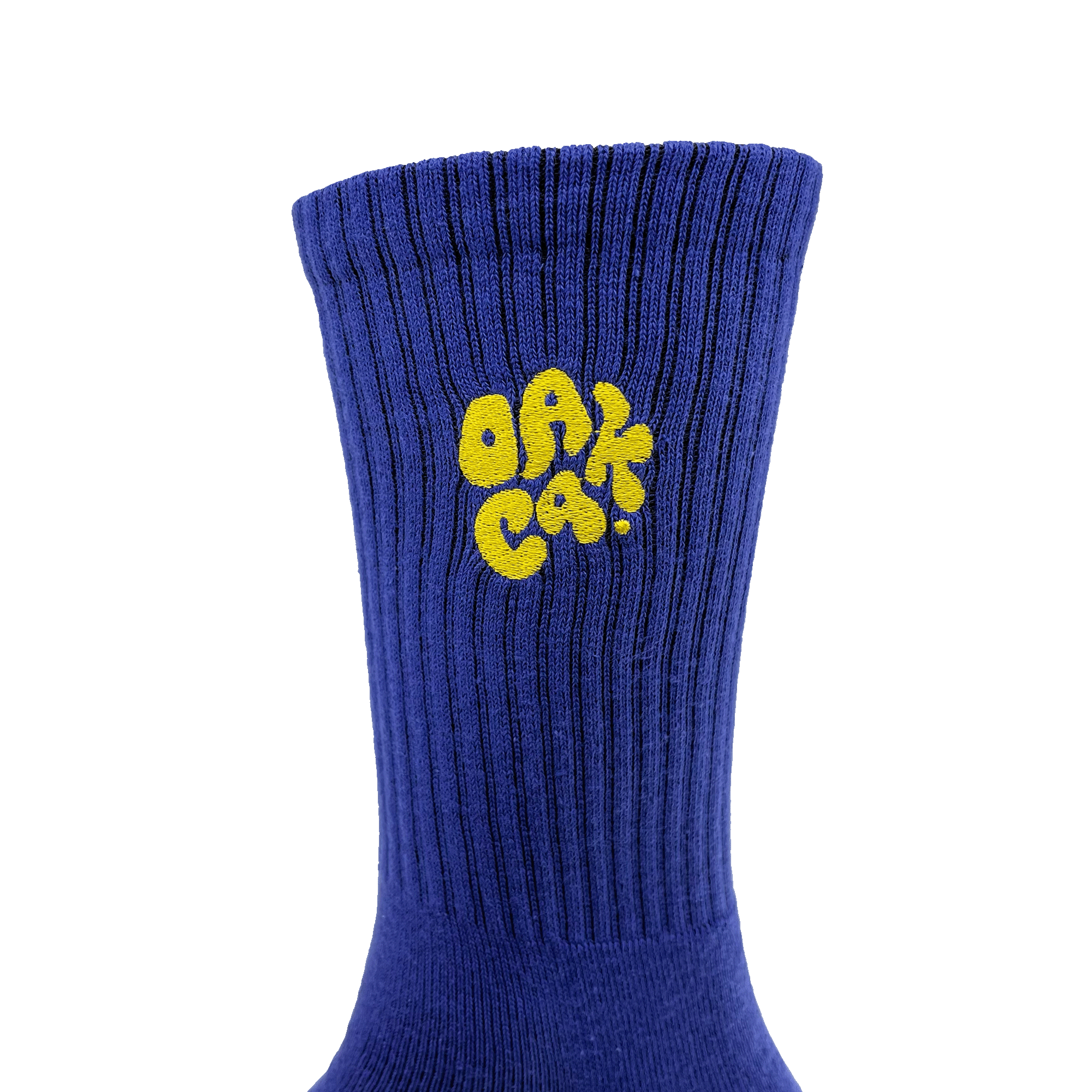 Close-up of embroidered yellow OAK CA blob-style wordmark on the side of blue crew sock.