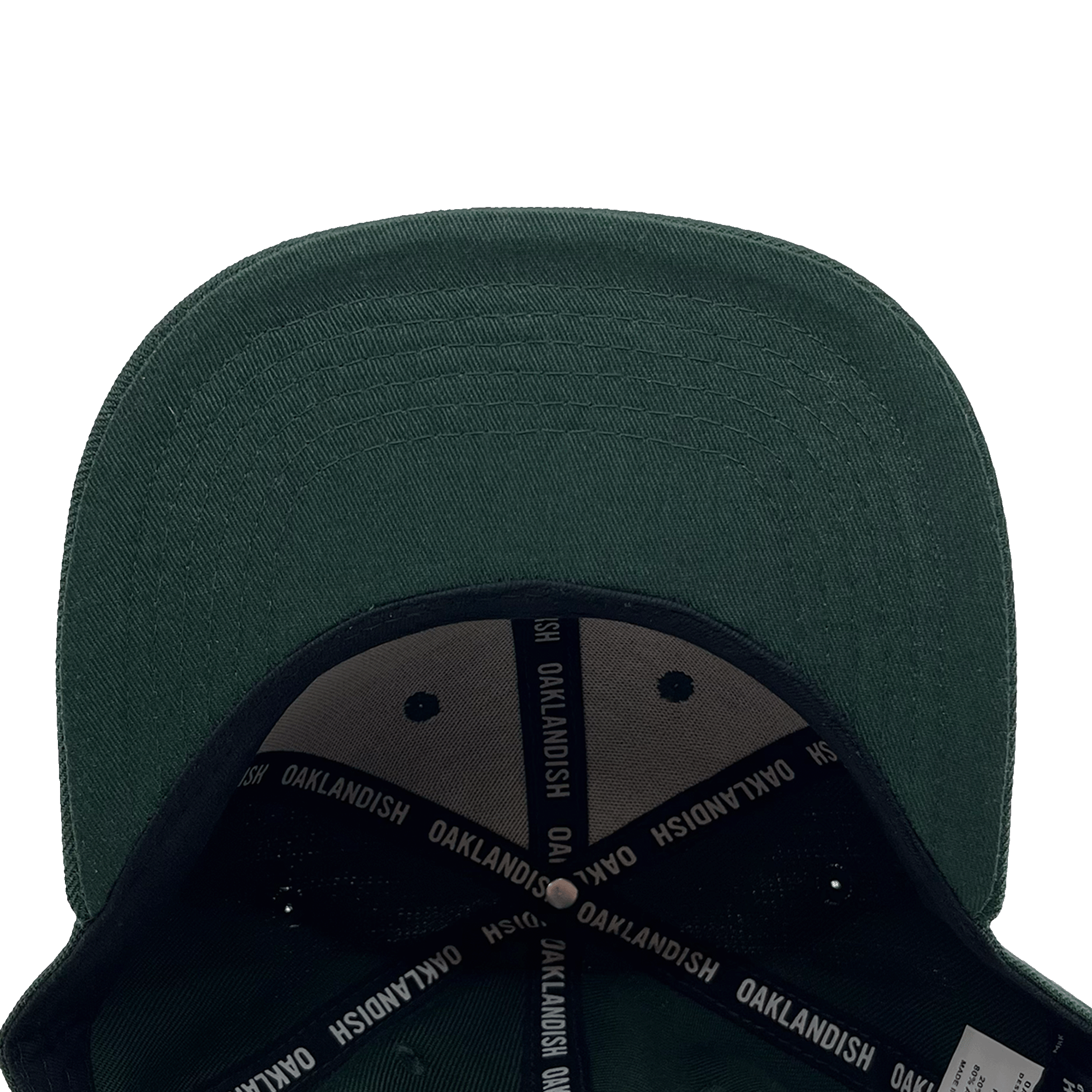 An Oakland Ballers Snapback in green, seen from above, displaying its wide, slightly curved brim. The underside showcases black fabric with white "OAKLANDISH" text repeatedly printed on the inner seams. The cap's interior structure reveals a partial view of a label referencing the Oakland Ballers professional baseball team.