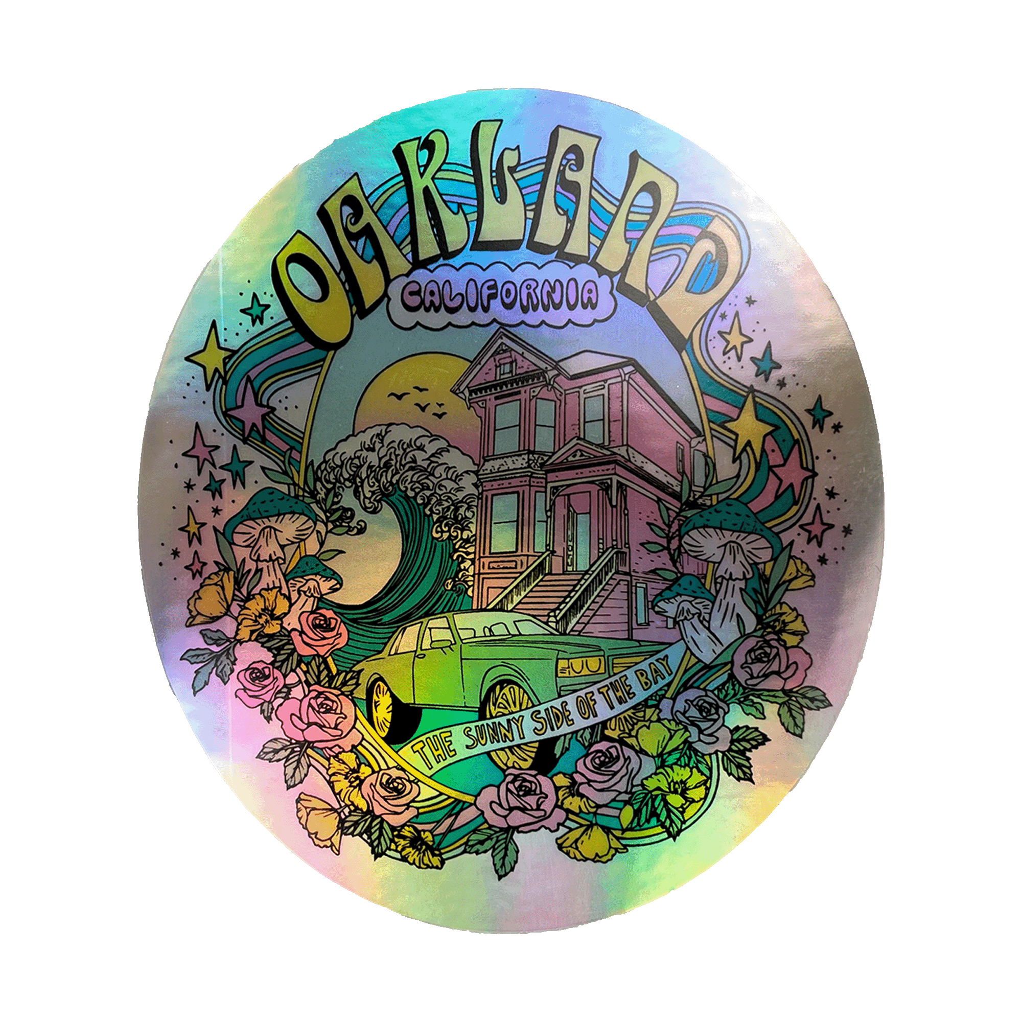 This Oakland Dream Holo Sticker by Oaklandish displays a vibrant, circular artwork showcasing a colorful, whimsical scene of Oakland, California. Prominent features include a Victorian house, classic car, waves, and flourishing flowers. "Oakland" arches at the top while "California" sits below it. A bottom banner reads "The Sunny Side of the Bay.