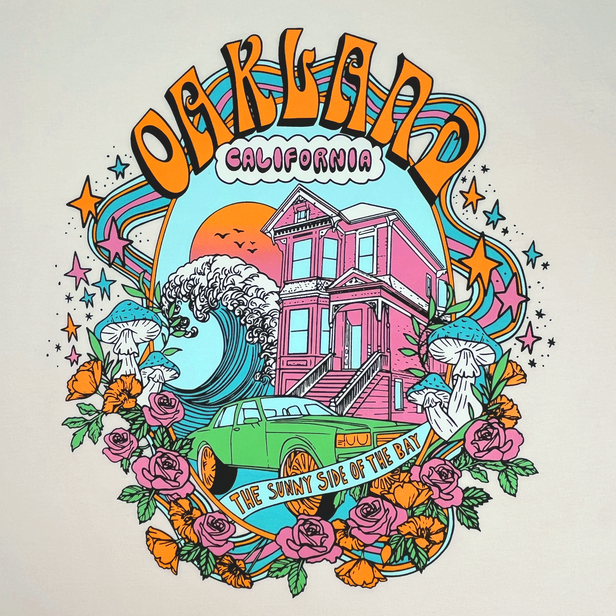 Detailed close-up of full-color dreamscape graphic with Oakland, California, Sunny Side of the Bay wordmark on a natural cotton-colored t-shirt.
