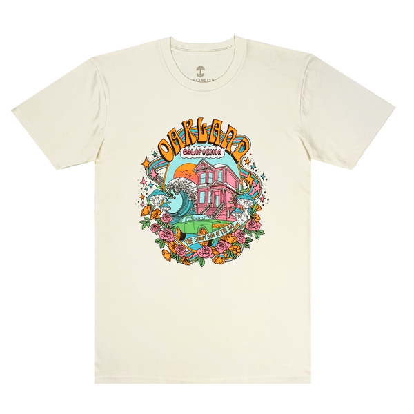 A natural cotton colored T-shirt with a full-color dreamscape graphic with Oakland, California, Sunny Side of the Bay wordmark.