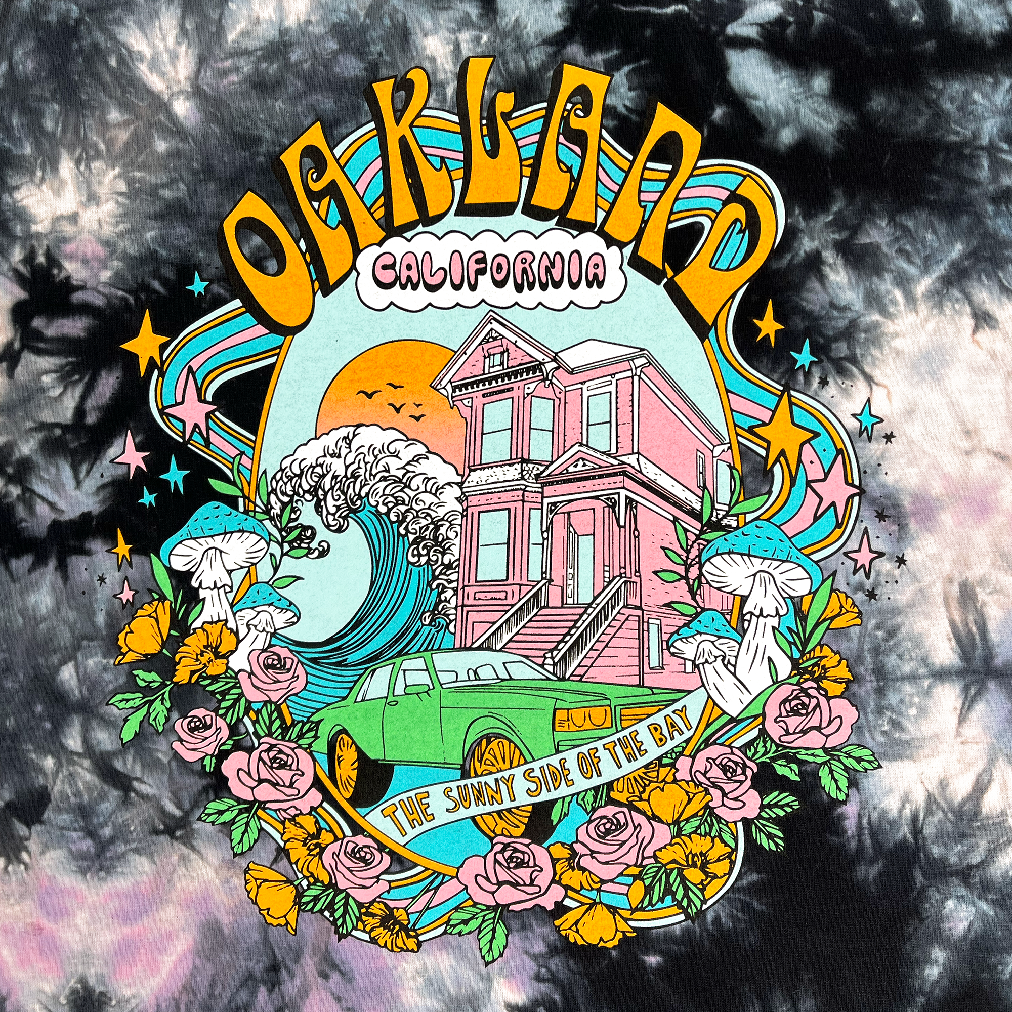 Detailed view of  Tie dye cotton t-shirt with Oakland Dream Oaklandish design.