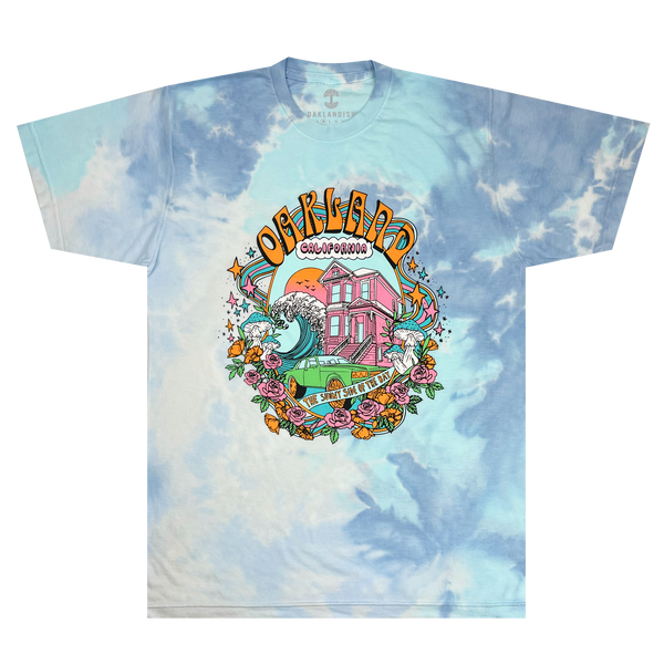 T-shirt with multiple tones of blue in tie-dye with full-color dream scape graphic with Oakland, California, Sunny Side of the Bay wordmark. 