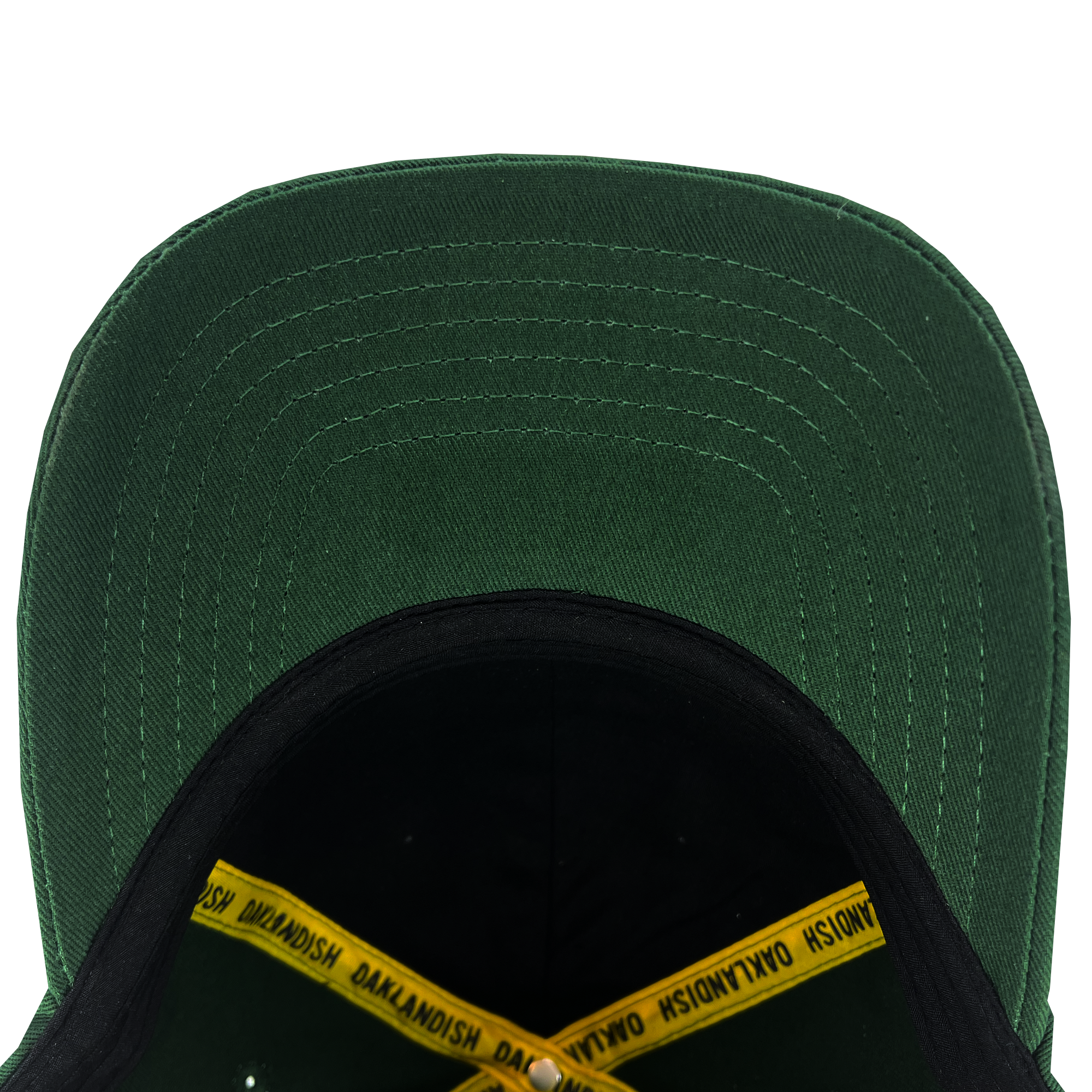 The Oakland Flag Dad Hat by Oaklandish, seen from above, reveals its interior and the underside of the bill. Inside, it highlights a black sweatband and a yellow hat band with "OAKLANDISH" printed repeatedly in black. The detailed stitching on the bill is visible, showcasing a series of parallel lines inspired by the design of the Oakland flag.