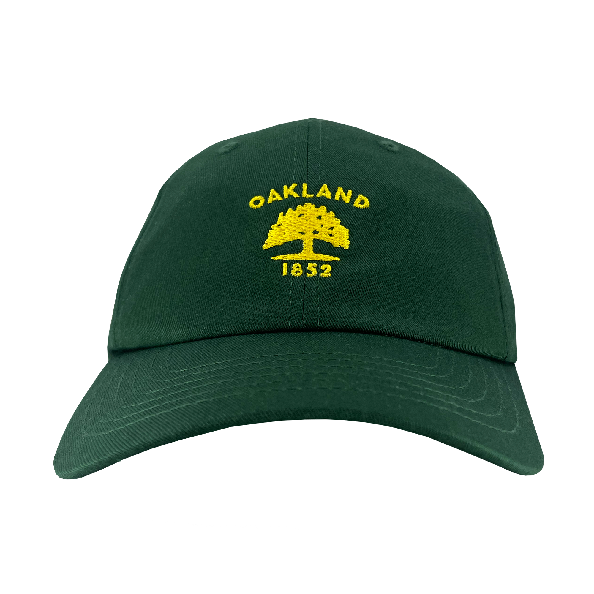 The Oaklandish Oakland Flag Dad Hat is a dark green cap that features the word "OAKLAND" in yellow, arched over an outline of a tree, with the year "1852" written below. The design, inspired by the Oakland flag, is prominently centered on the front. The hat also includes a curved brim and visible stitching.