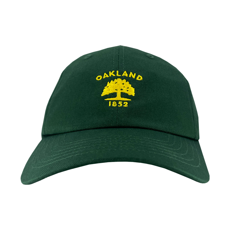 Front view of forest green cotton dad hat with yellow embroidered Oakland Flag 1832 logo on the crown. 