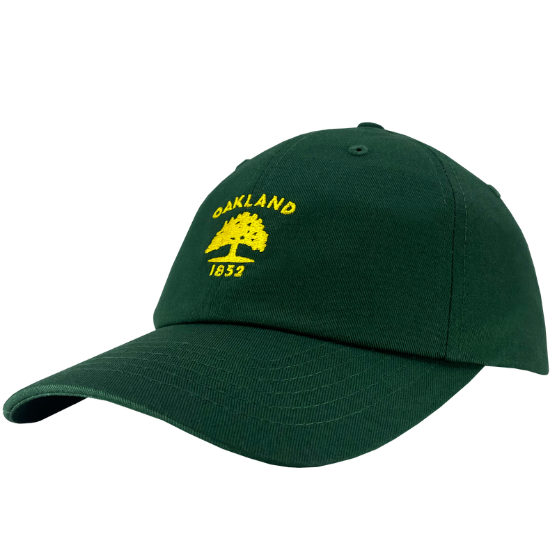Side view of forest green cotton dad hat with yellow embroidered Oakland Flag 1832 logo on the crown. 