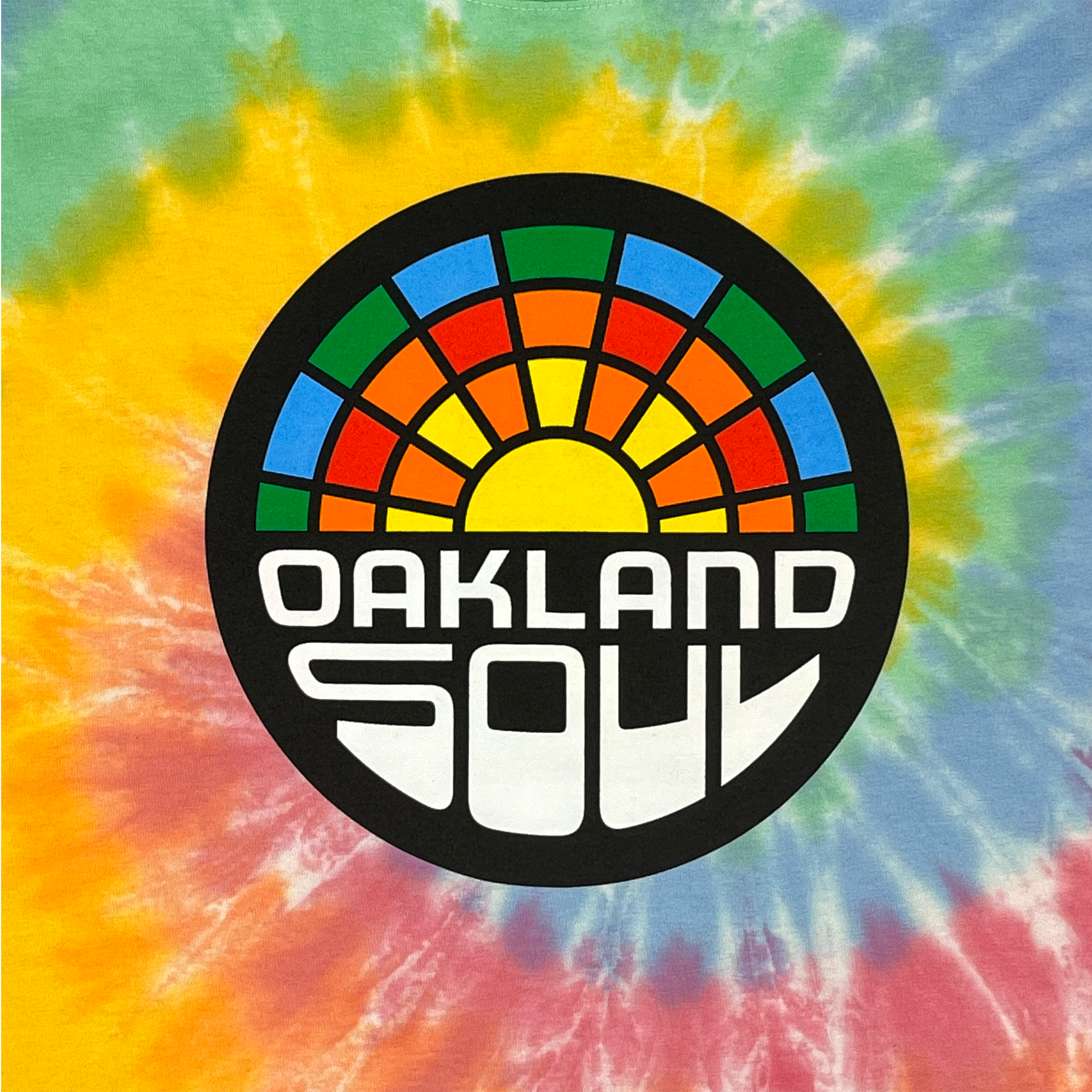 Detailed view of Sherbet Tie dye cotton t-shirt with Oakland Soul SC Crest.