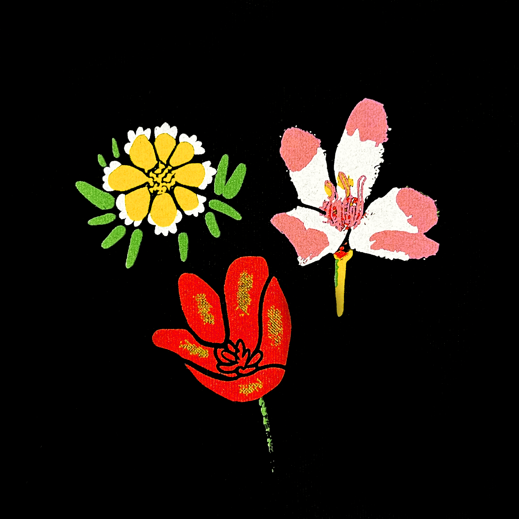  Detailed close-up of three colorful wildflowers on the left chest of a black t-shirt.