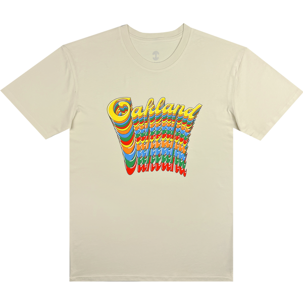 Natural cotton color t-shirt with Oakland wordmark in script on repeat in rainbow color on front chest.