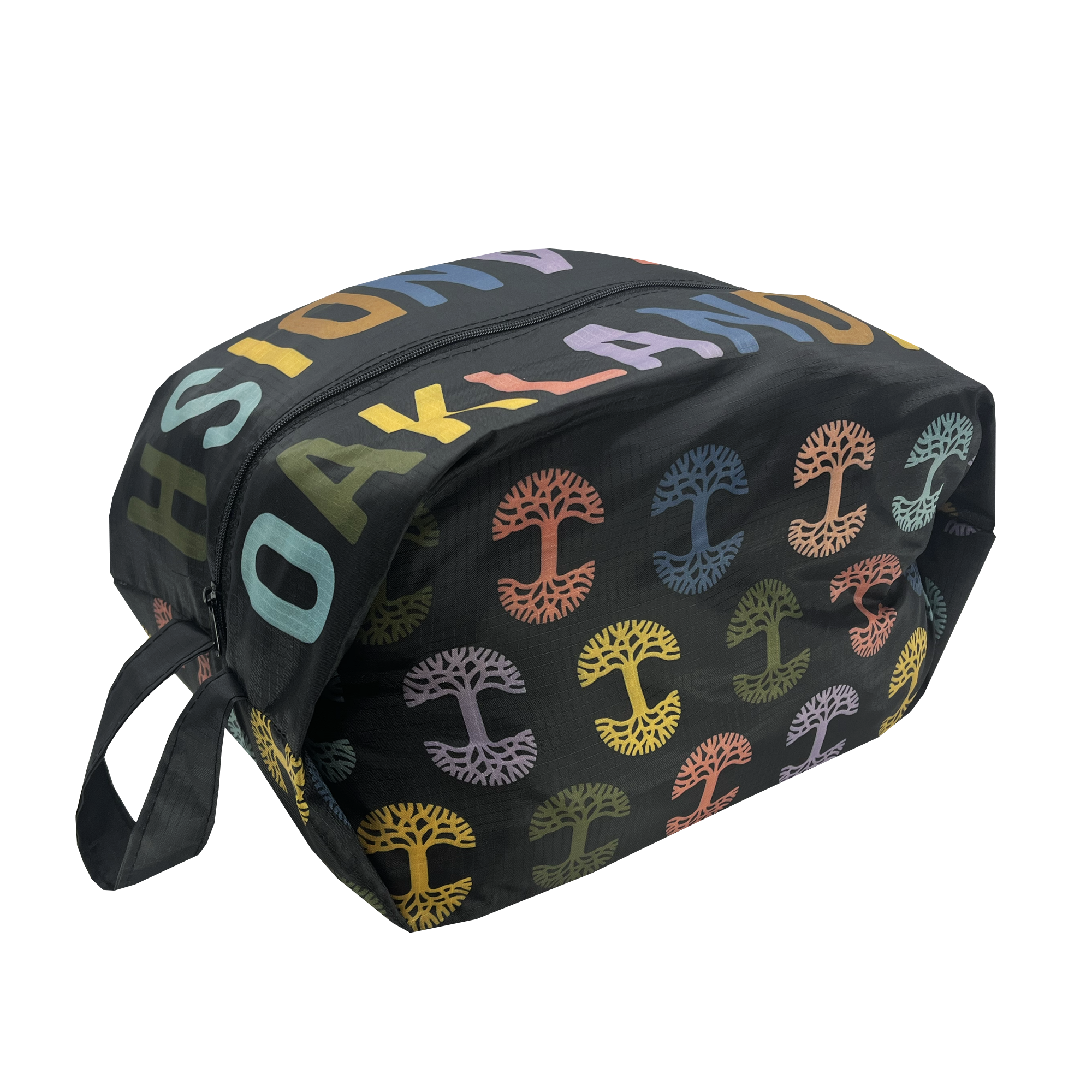 Side-angle view of a black zippered collapsible cosmetic and toiletry dopp bag with multi-color Oaklandish tree logos on repeat and Oaklandish wordmarks on the top.