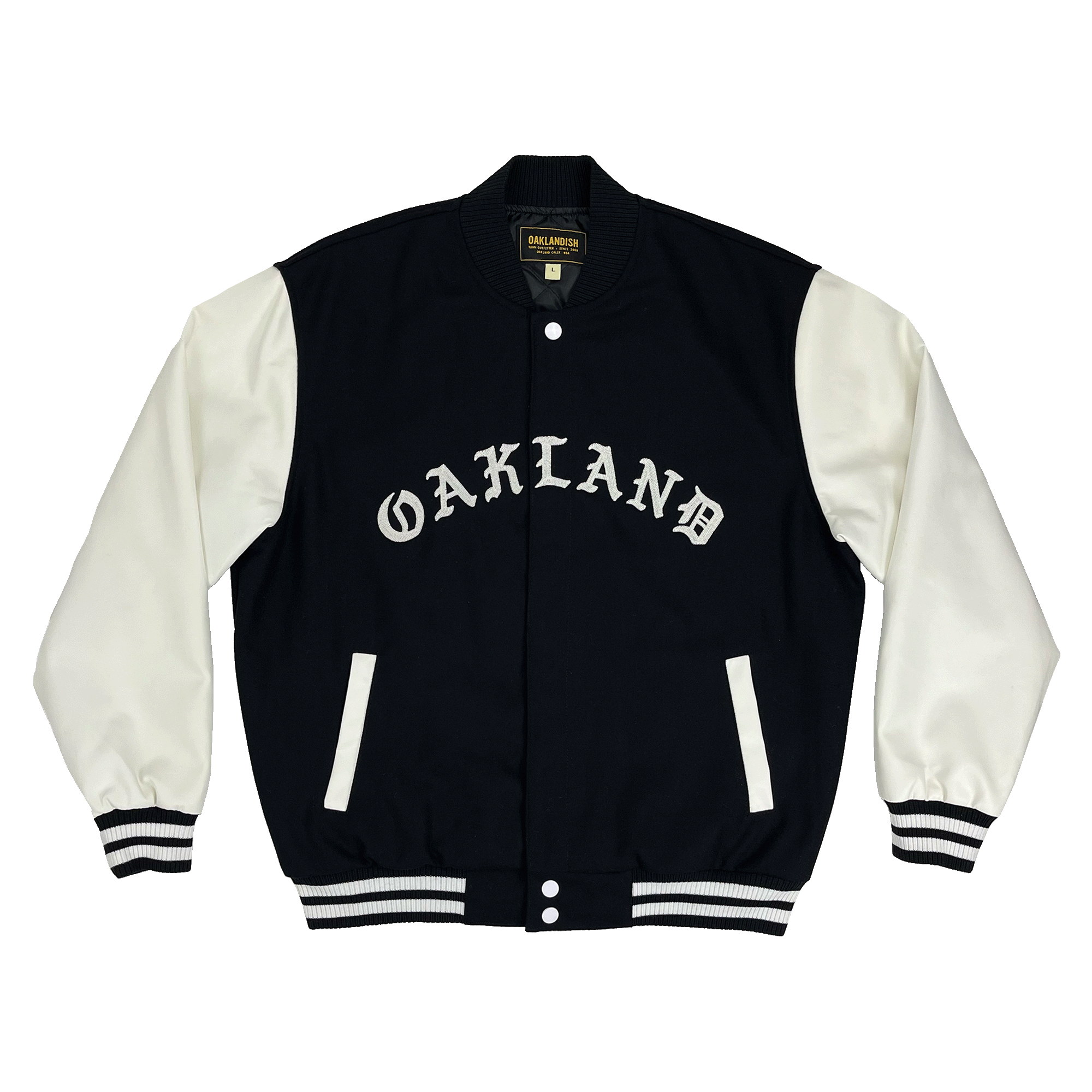 Front-view of a black varsity jacket with white sleeves and black and white striped trim with a large white OAKLAND wordmark stitched onto the front chest.
