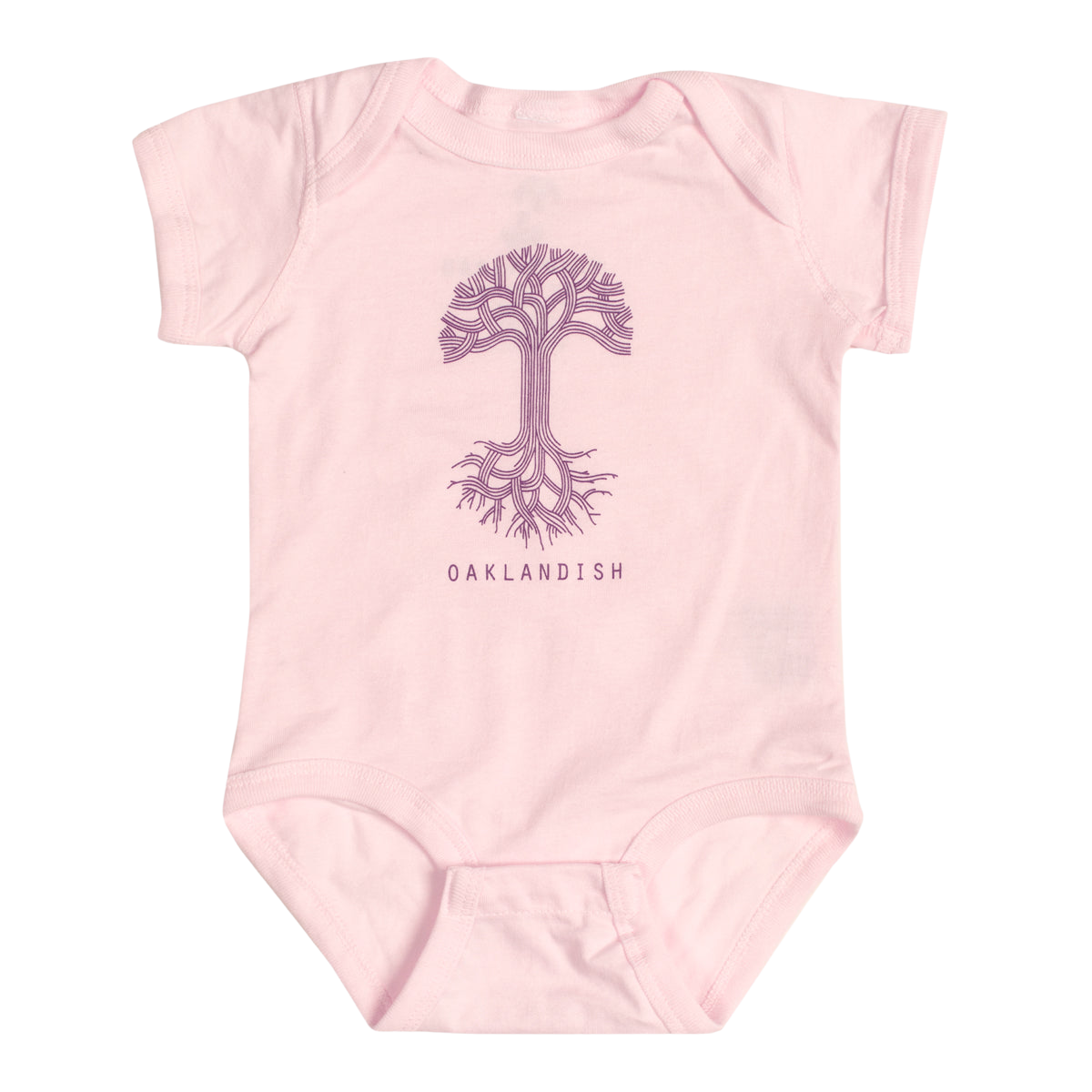 The Infant Oaklandish Classic Logo One-Piece by Oaklandish is a pink, short-sleeve baby romper made from 100% cotton. It showcases a line-drawn image of a tree with intricate branches and roots at the center, with "OAKLANDISH" prominently printed in bold capital letters below the tree. The onesie is displayed on an unadorned white background.