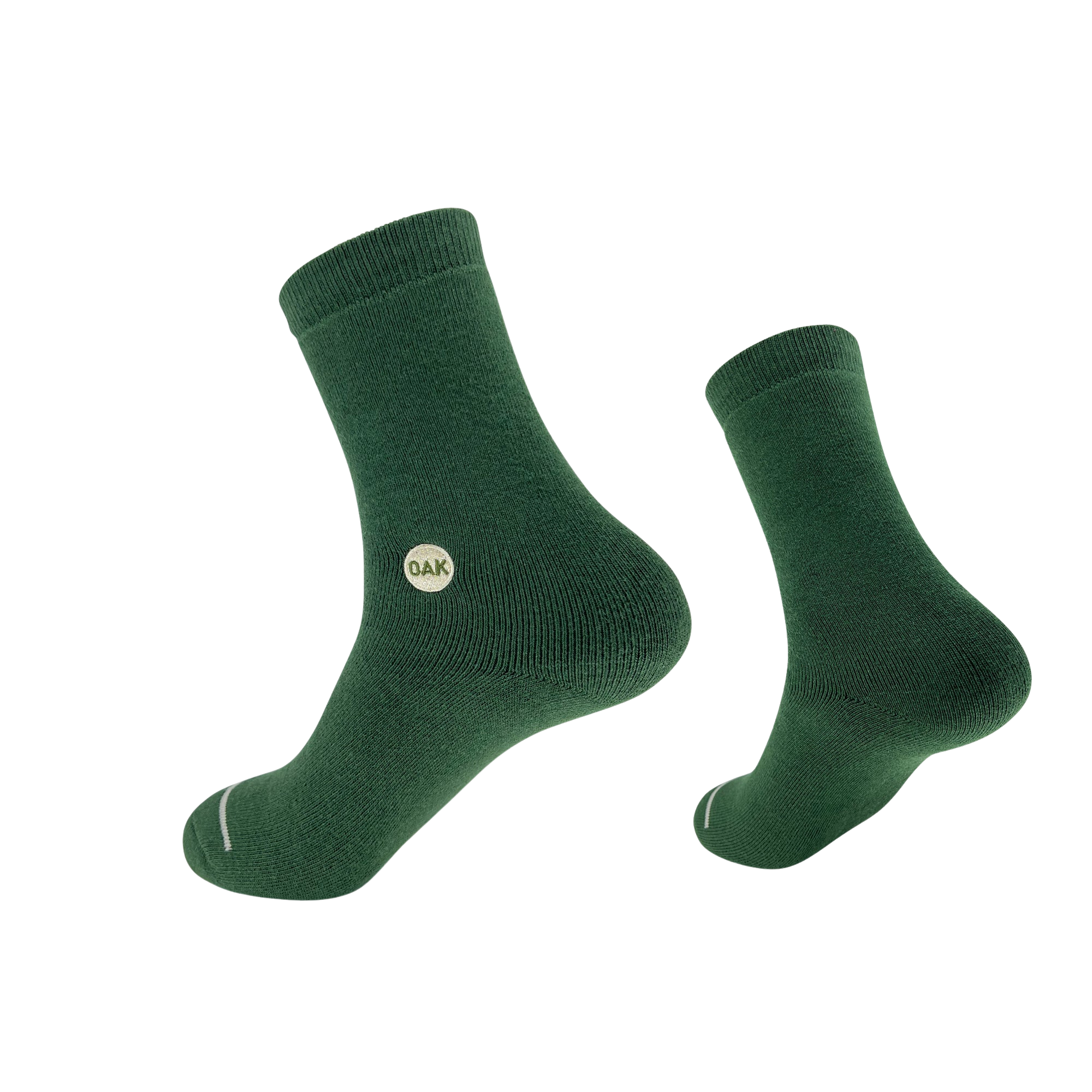 A pair of green Plush Oak Socks from Oaklandish is displayed against a plain white background. Crafted from soft cotton, these socks feature a ribbed cuff and a small circular "OAK" logo on the side. Artfully arranged, one sock presents a side view while the other is slightly elevated, promising happy feet.