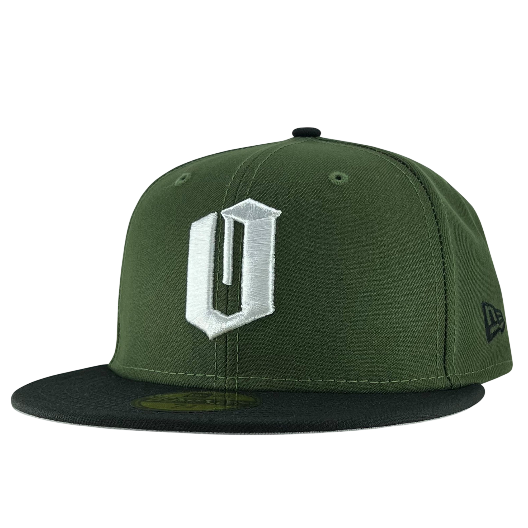 A green New Era Official 59FIFTY Fitted Cap from the brand Other, this fitted hat features a black flat brim and a prominent white embroidered “U” on the front. The signature New Era logo is stitched in black on the left side, while ventilation eyelets on the top ensure breathability.