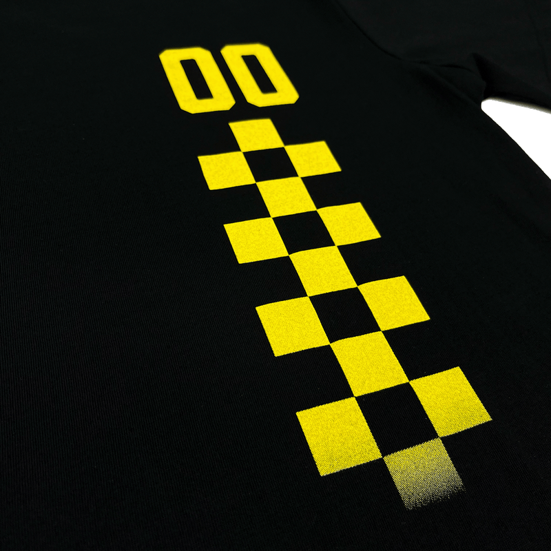 Close-up of yellow race car-inspired design checkered pattern.