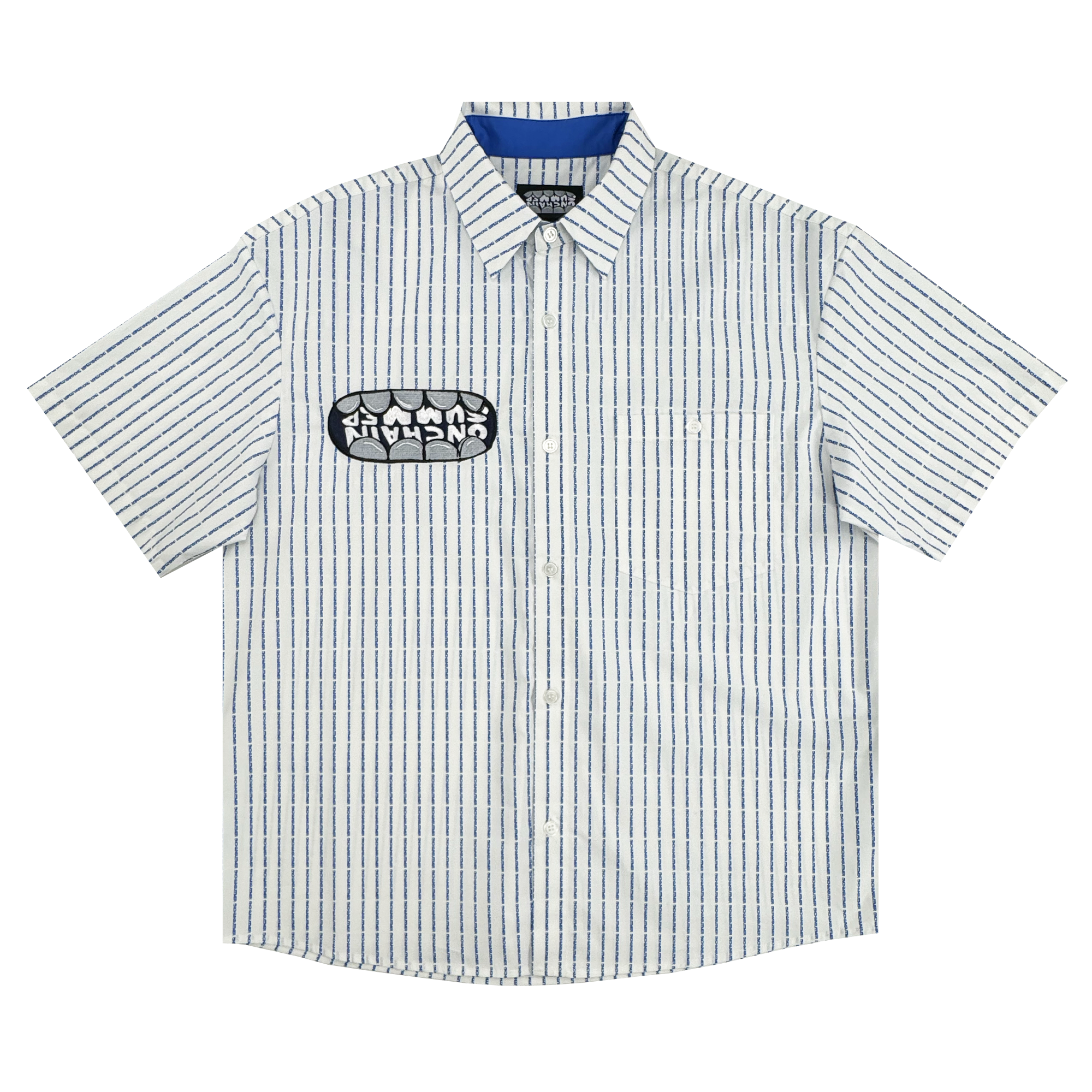 The OG Bottom Shirt by Supported Brands is a 100% cotton short-sleeve button-up with a white base and thin navy stripes, pointed collar, blue inner collar lining, and a bold black and white stylized patch on the left chest.