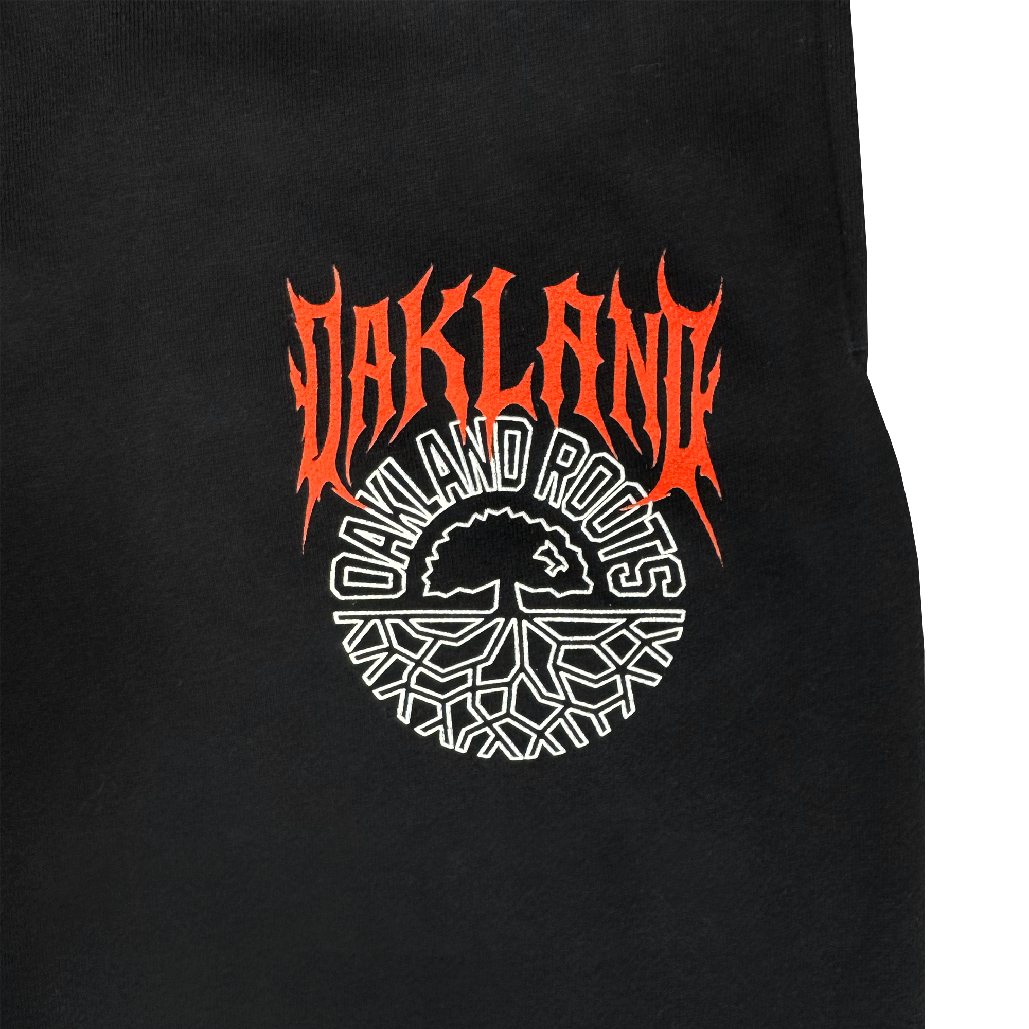 Black fabric with bold, red, flame-styled "OAKLAND" over "OAKLAND ROOTS" in white, plus a circular white tree logo. Style pairs perfectly with the Oakland Roots SC Forge Pant. Men's sizes available from Oakland Roots SC.