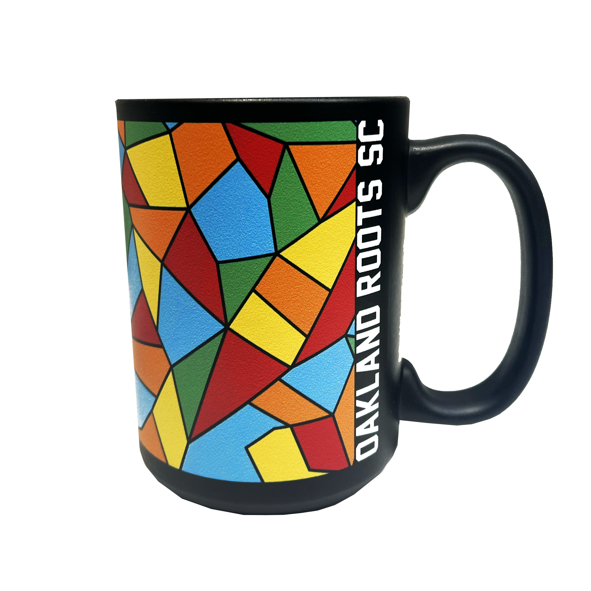 The Oakland Roots SC Mosaic Coffee Mug boasts a vibrant geometric pattern featuring an array of red, green, blue, yellow, and orange shapes on its black surface. Adorned with the text "OAKLAND ROOTS SC" vertically in white alongside the handle, this mug is perfect for soccer fans. The handle matches the sleek black design of this Oakland Roots Sports Club item.