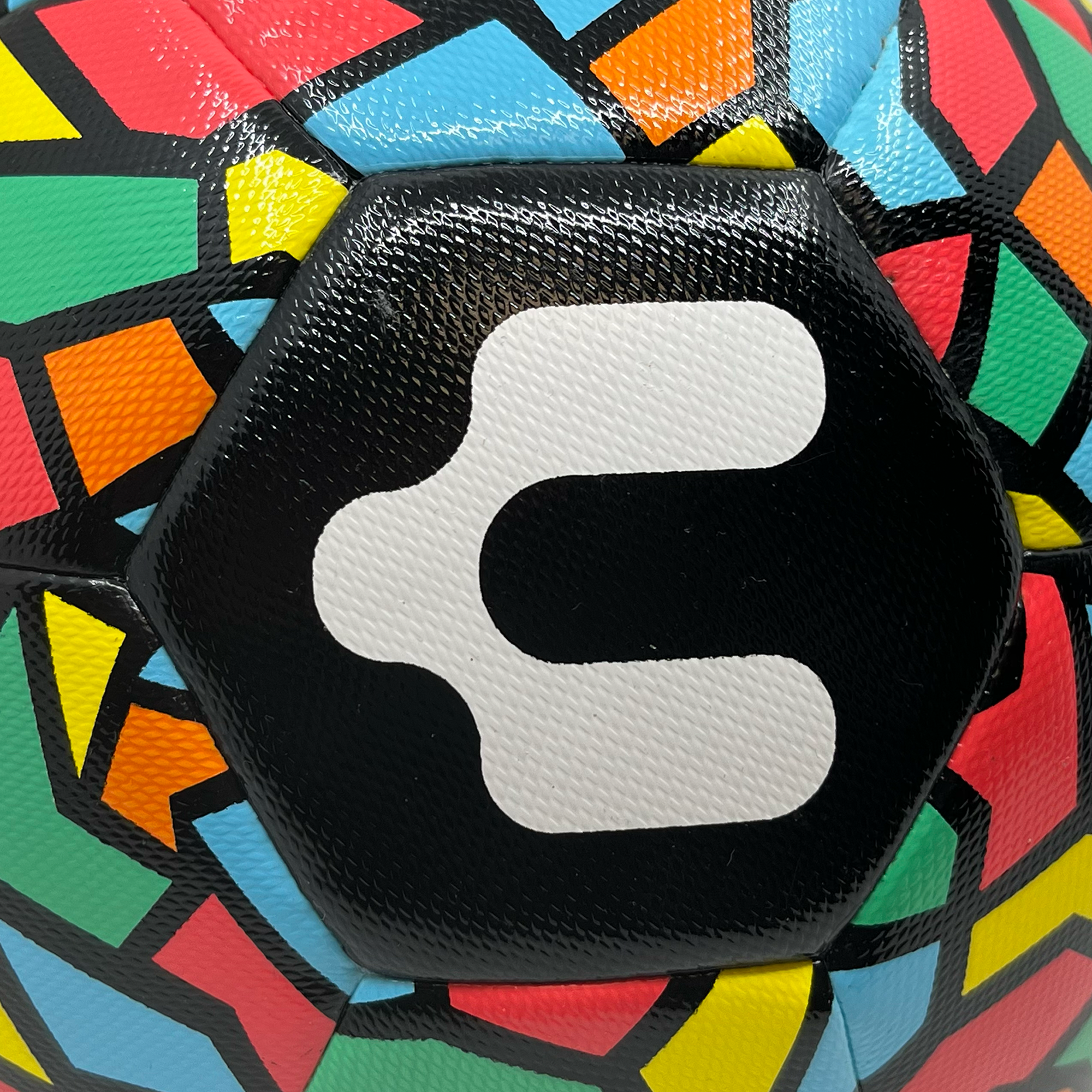 Detail shot of Charly logo on soccerball.