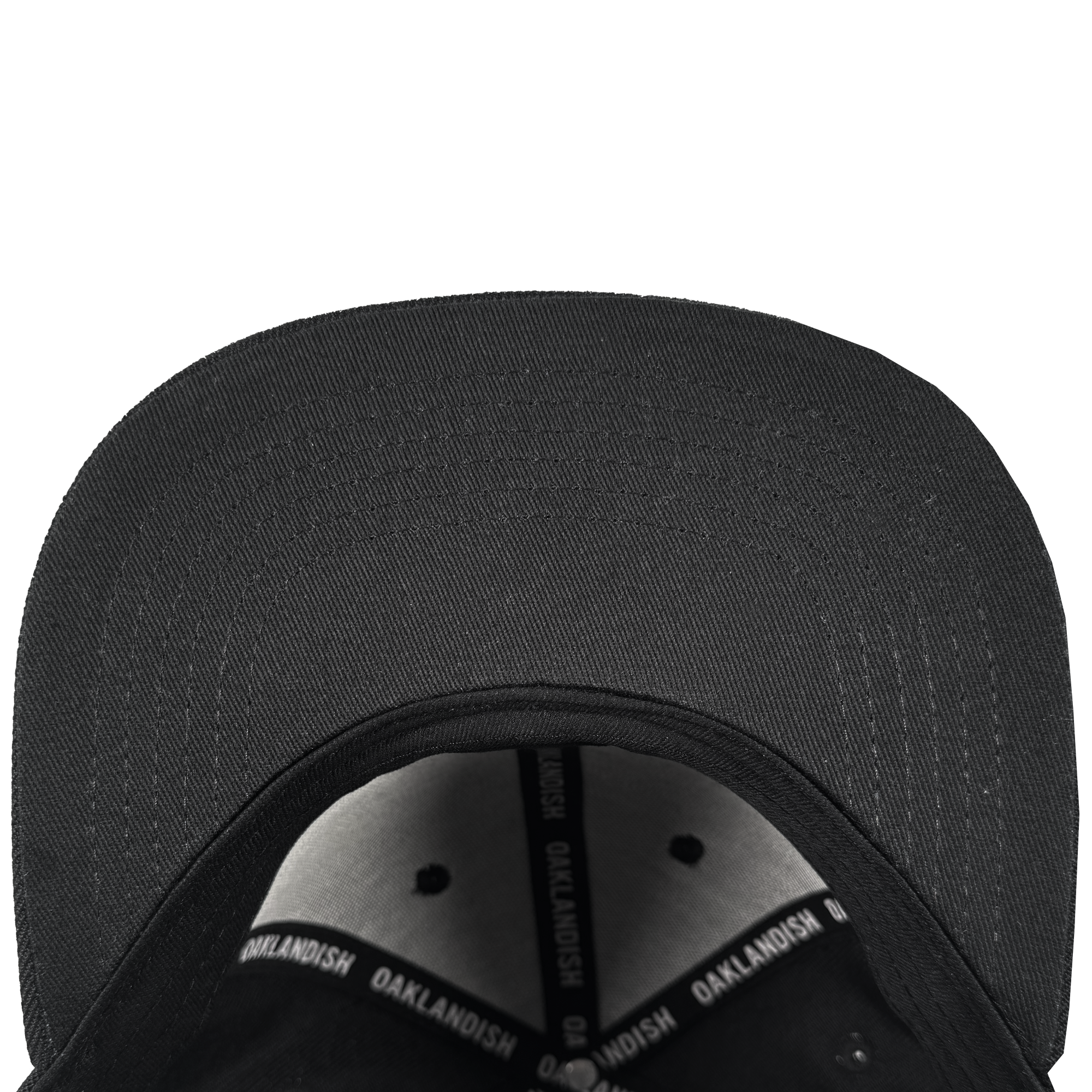 Top-down view of the Oakland Roots SC Structured Snapback by Oakland Roots SC, highlighting the black brim, interior stitching, metal rivets, and an inner band with white "OAKLANDISH" text—all set against a white background.