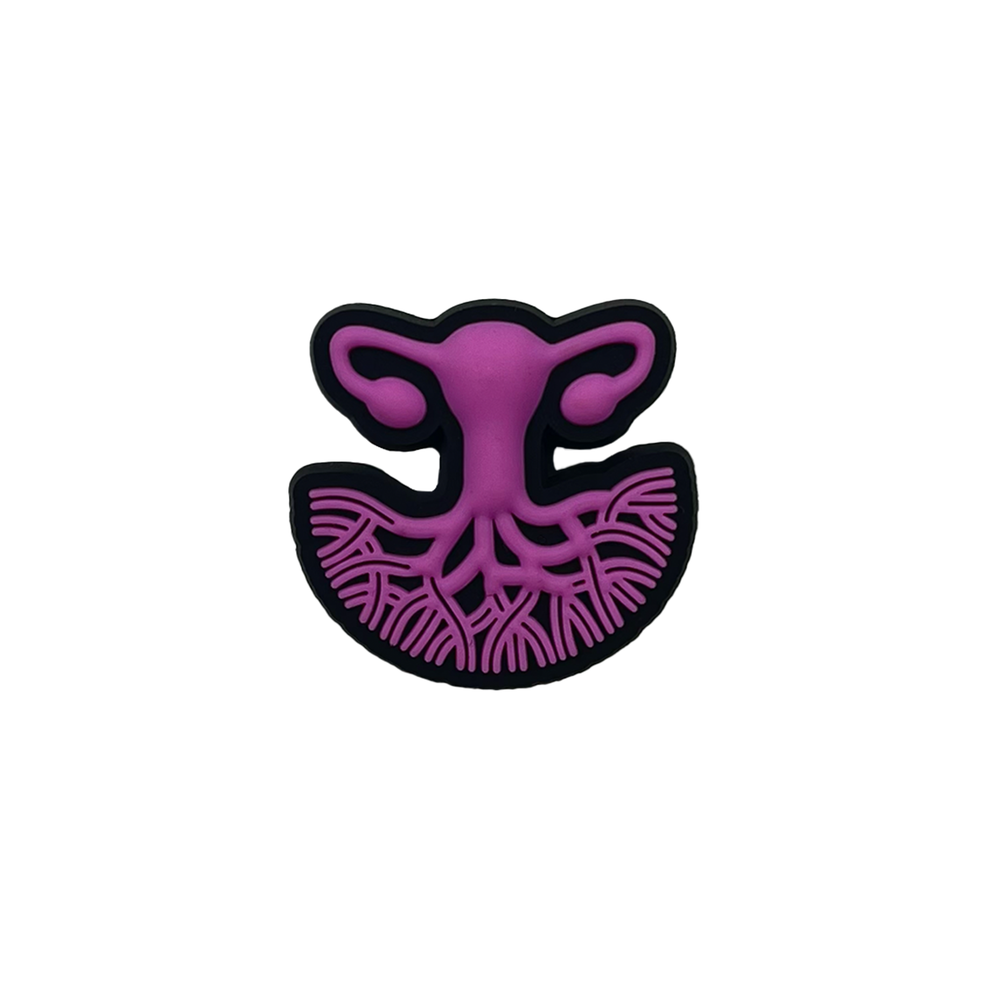 A stylized illustration of the female reproductive system in purple, featuring the uterus, fallopian tubes, and ovaries. The lower section showcases branching blood vessels, while the entire image is outlined in black against a transparent background. This design symbolizes women's healthcare and is presented on the Isha Shoe Charm by Oaklandish.