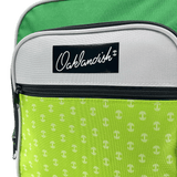 Detailed close-up of the Oaklandish logo patch on the front zippered pouch of a green and grey primary school back pack.