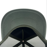 Under visor view of cypress green truckers cap.