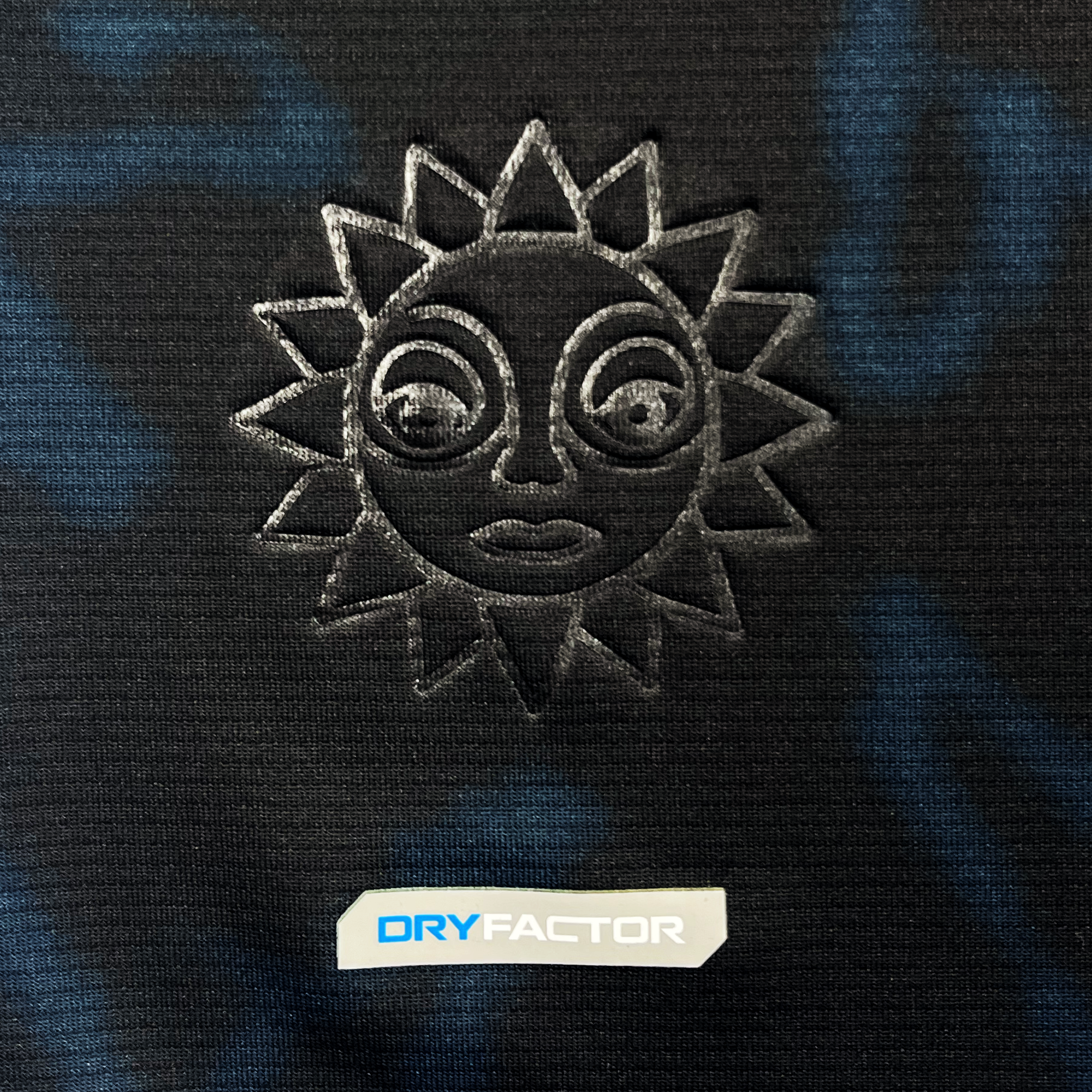 Detailed view of Oakland Soul sun logo on black Oakland Soul jersey.
