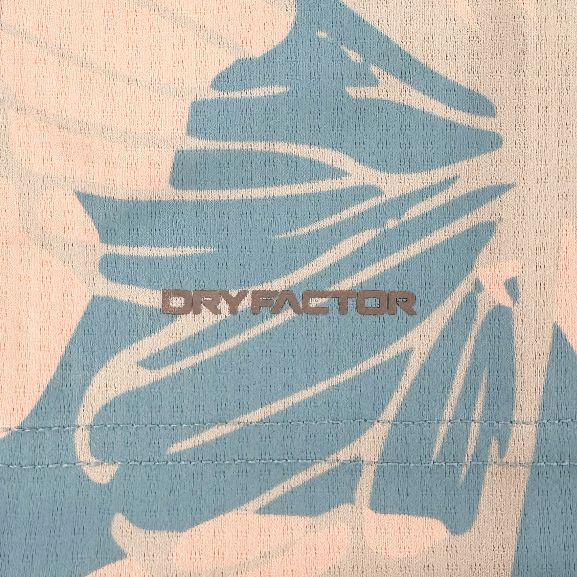 A close-up of the Custom Butterfly Effect Kit by Oakland Soul shows pale pink and light blue abstract leaves. "DRYFACTOR" appears in bold gray uppercase letters at the center, with horizontal stitching visible near the bottom.