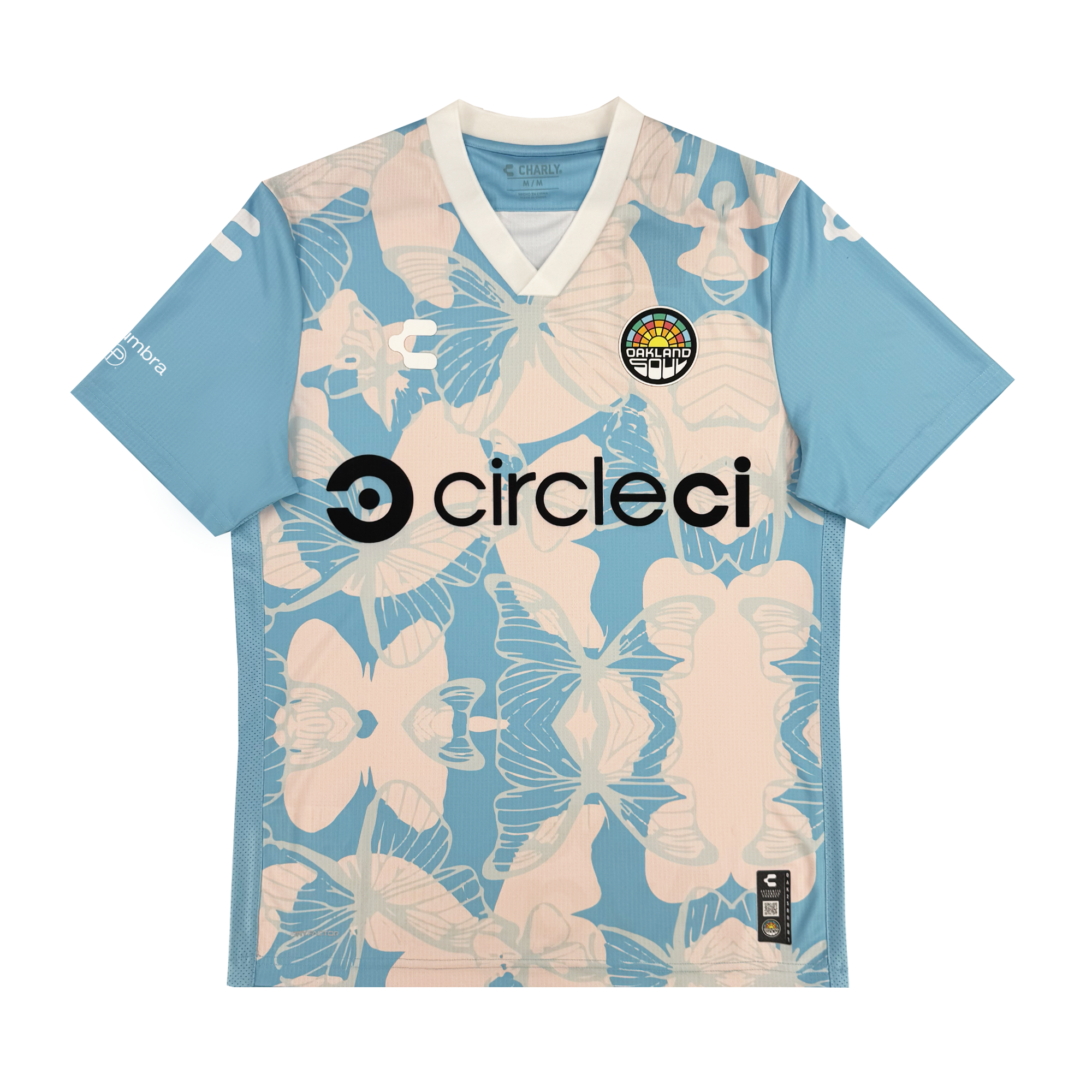 A light blue Oakland Soul Unisex Butterfly Effect Kit soccer jersey with pale beige butterflies, a black "circleci" sponsor logo, a circular rainbow "Creative Club" chest badge, white sleeve logos, and a v-neck collar with white insert.