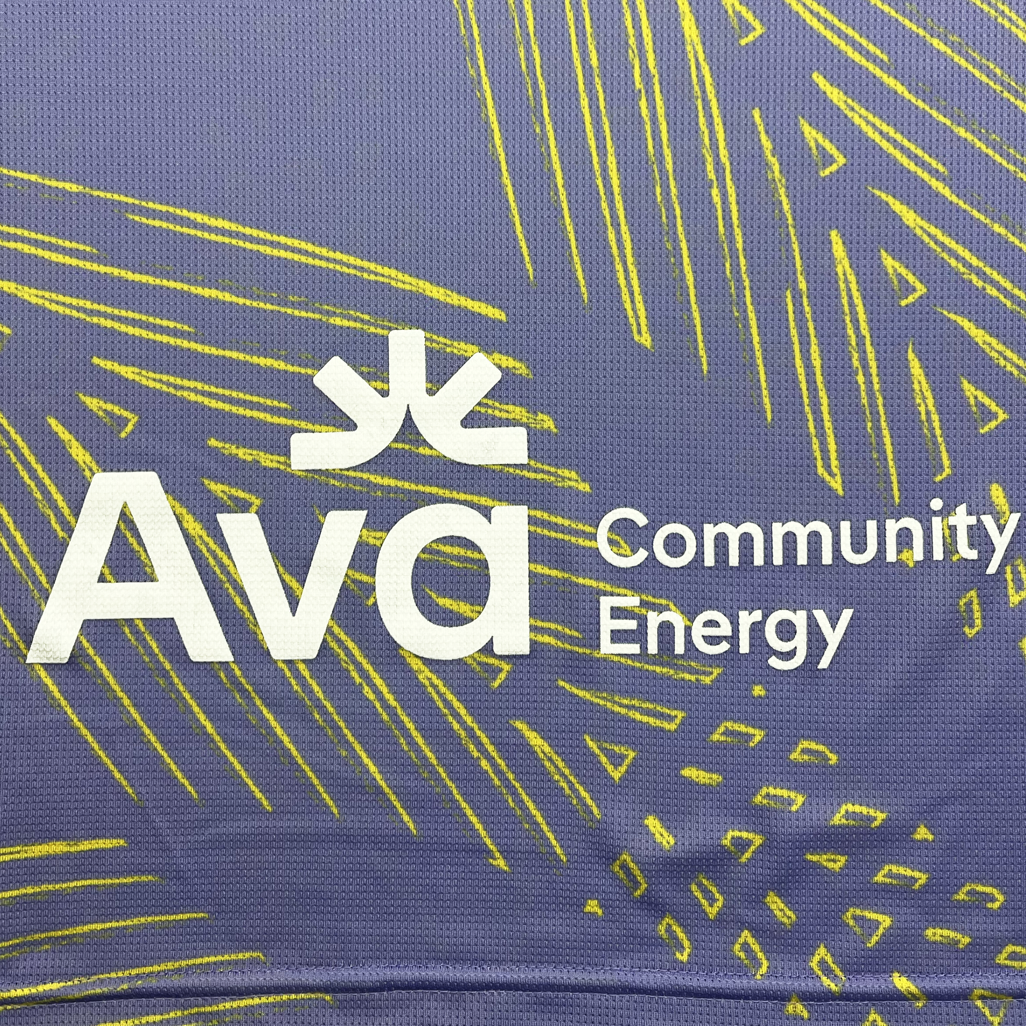 Back detailed view of lavender color Oakland Soul x Charly soccer jersey with Ava Community Energy logo.