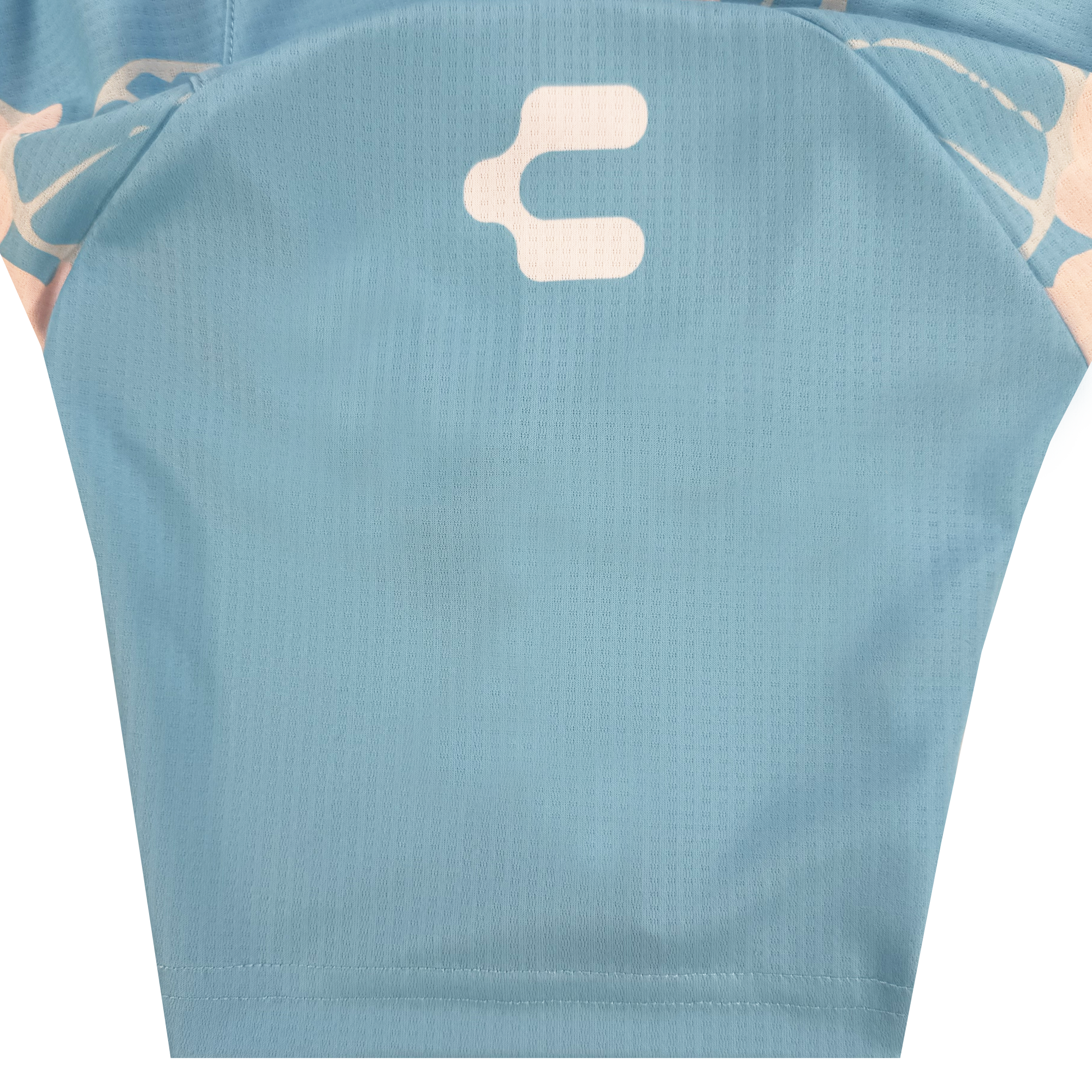 A close-up of the Oakland Soul Custom Butterfly Effect Kit shows light blue mesh-like fabric, a white abstract rounded symbol on top, and pale pink and white accents along the upper sleeve area inspired by creative Oakland spirit.