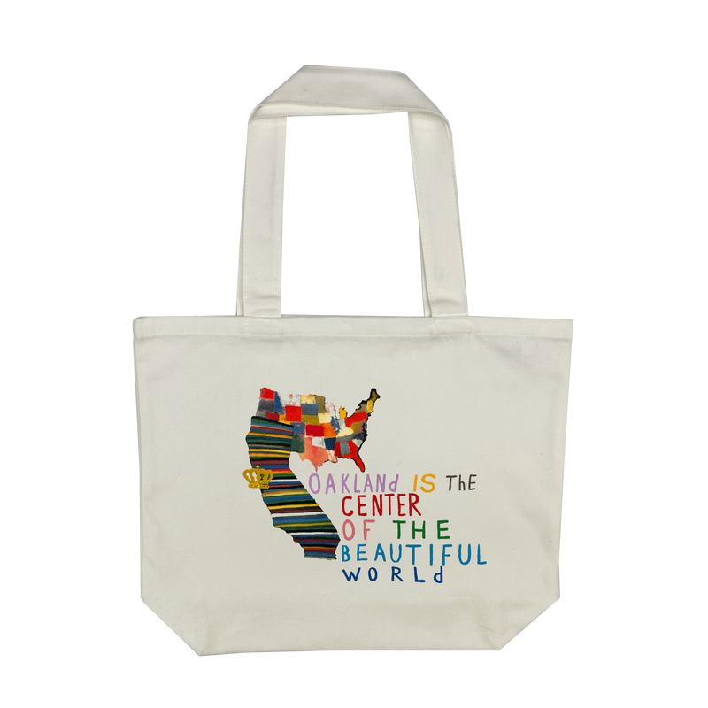 Oakland Is the Center of World mural art by contemporary artist Squeak Carnwath on a cream colored cotton shopping tote.