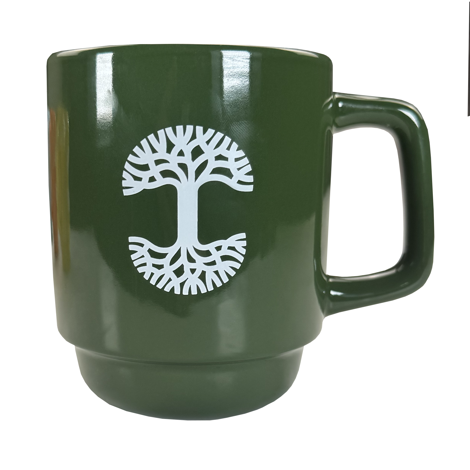 The Oaklandish Logo Stack Mug is a dark green ceramic mug with a large handle, featuring a white circular graphic of a stylized tree with symmetrical branches and roots on the front.
