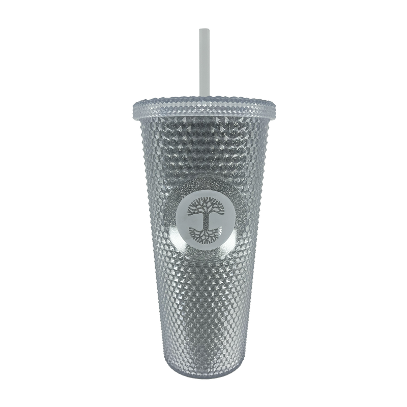 Silver studded bling travel tumbler with lid and straw and Oaklandish tree logo.