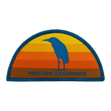 Multi-color iron-on half circle patch with night heron at sunset with Oakland, California wordmark.