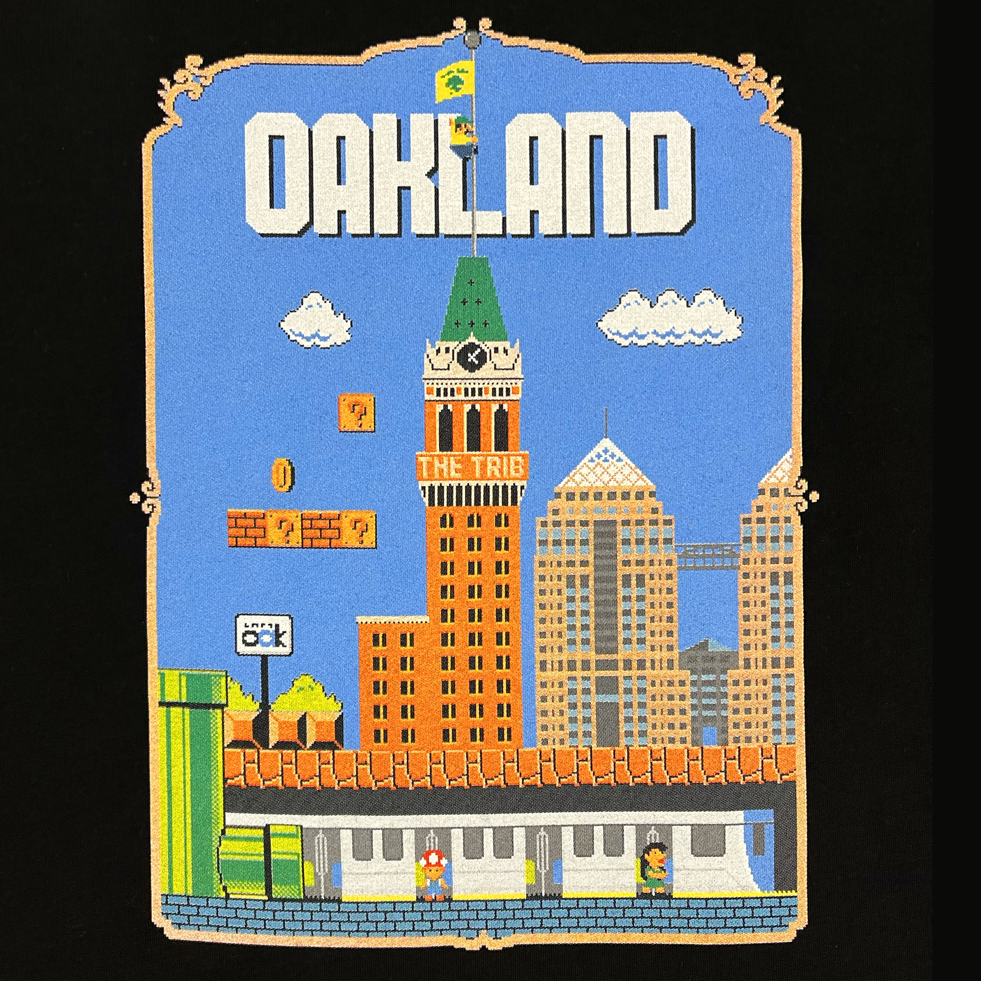 Close up of Super Mario style graphic with Oakland cityscape on faded black t-shirt.