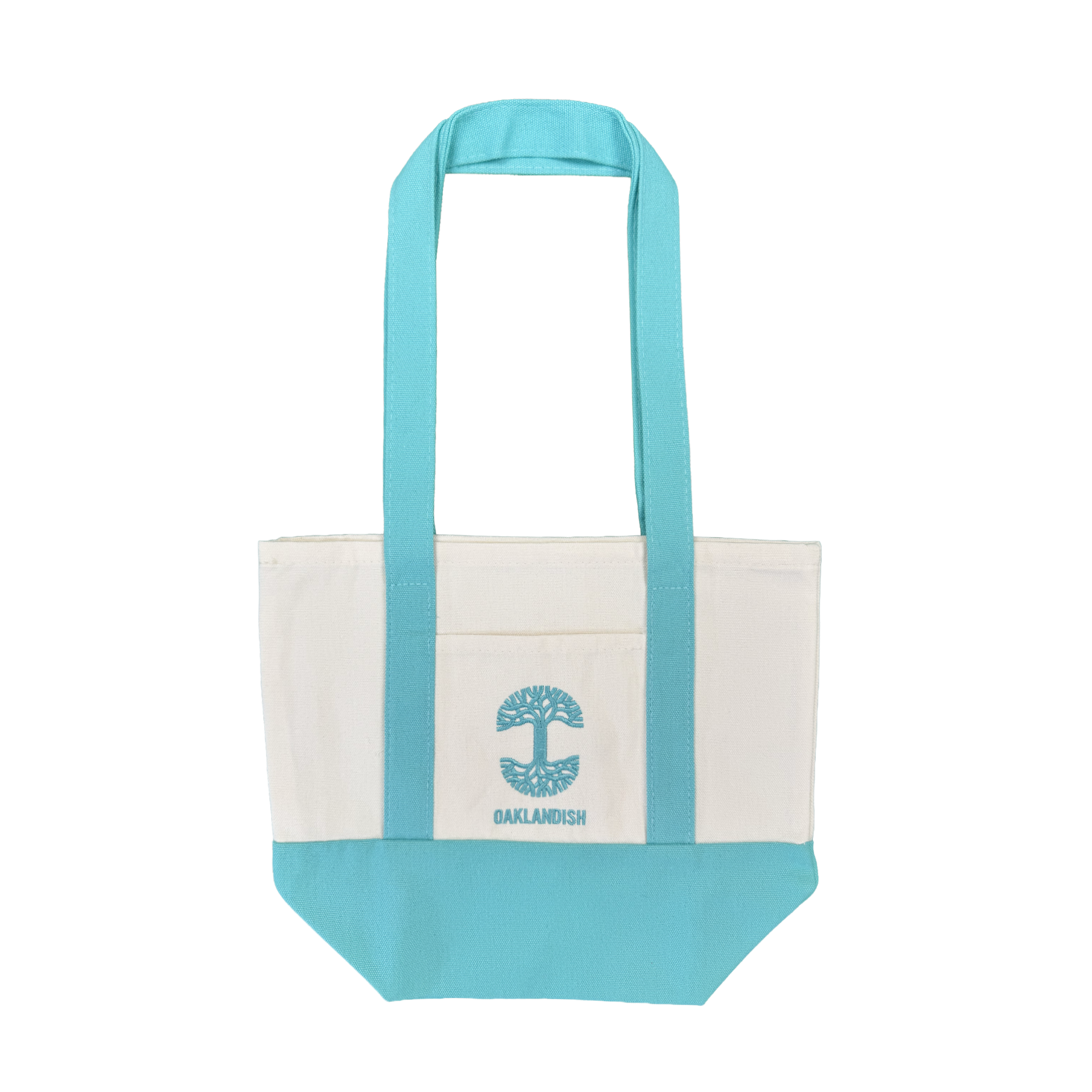 Introducing the Oaklandish Mini Grocery Tote by Oaklandish—a canvas tote bag featuring aqua blue handles and bottom, a white body, and a convenient front pocket. The pocket is adorned with an embroidered aqua blue tree graphic and “OAKLANDISH” written below. Ideal for use as a mini grocery tote or carrying your everyday essentials. Shown against a plain white background.