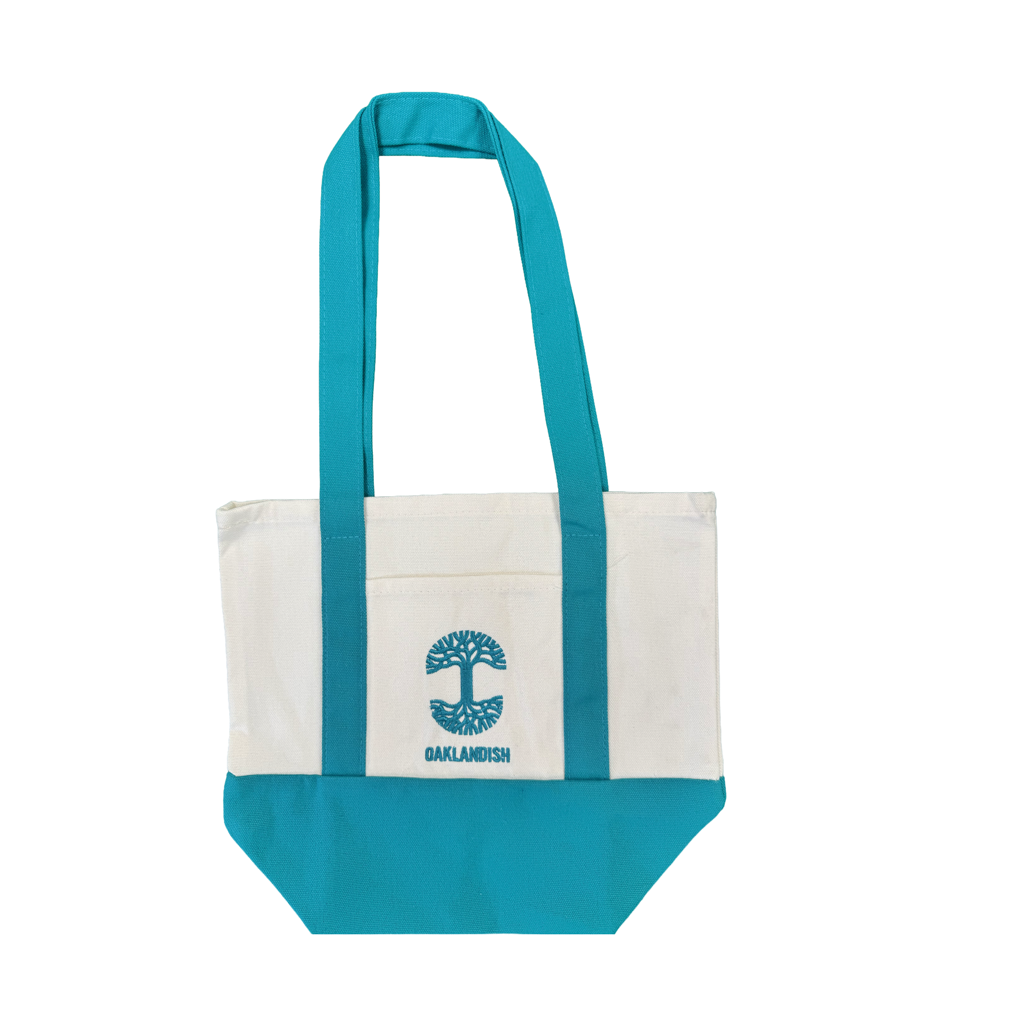 The Oaklandish Mini Grocery Tote by Oaklandish features teal blue handles and bottom with a white center. An embroidered turquoise tree logo and the word “OAKLANDISH” decorate the front pocket. The tote is shown on a plain white background.