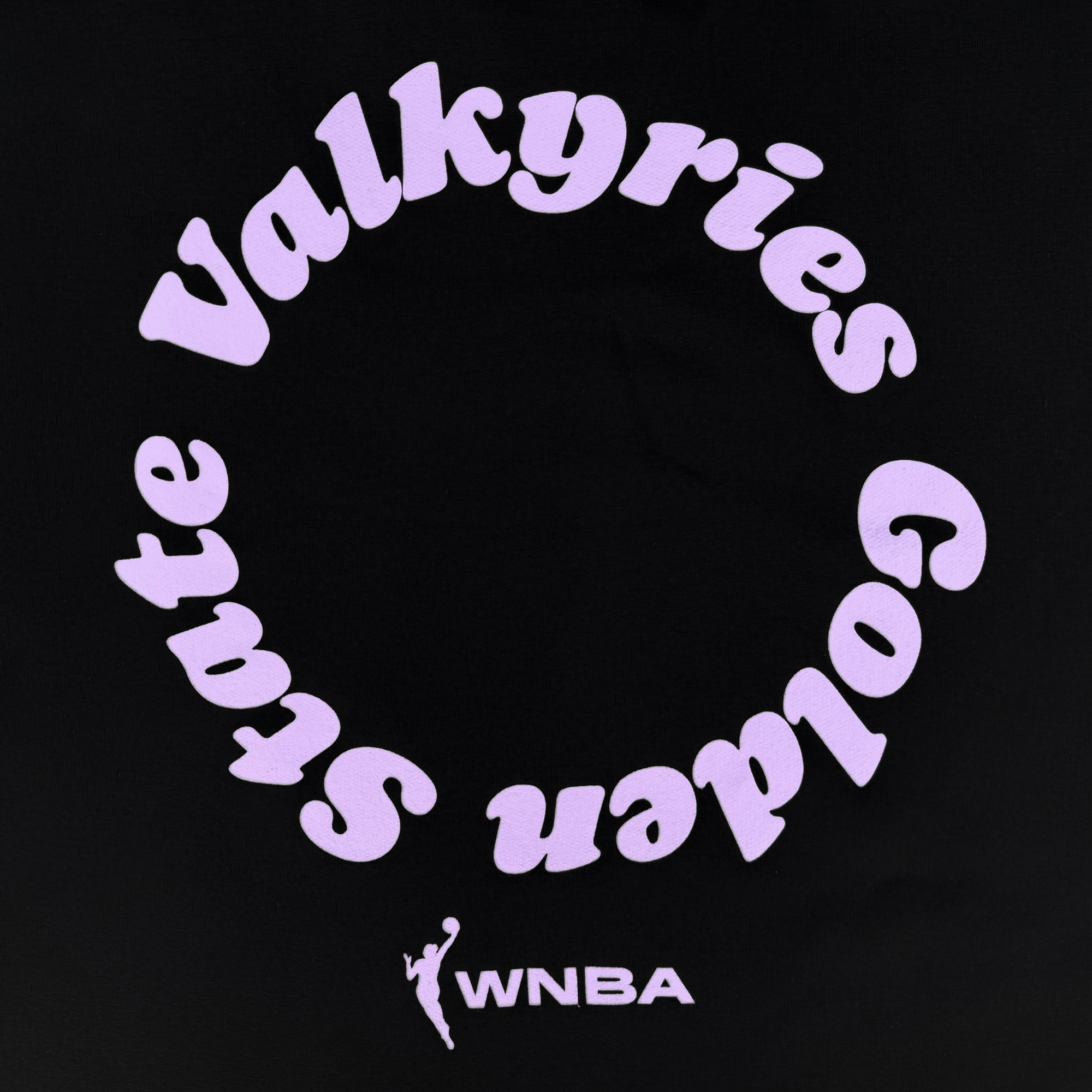 The GSV Golden State Valkyries Circle Lock Up Crew features circular lavender text on black, playful font, and matching WNBA logo/initials at the bottom, all on premium heavyweight fleece—perfect for fans.