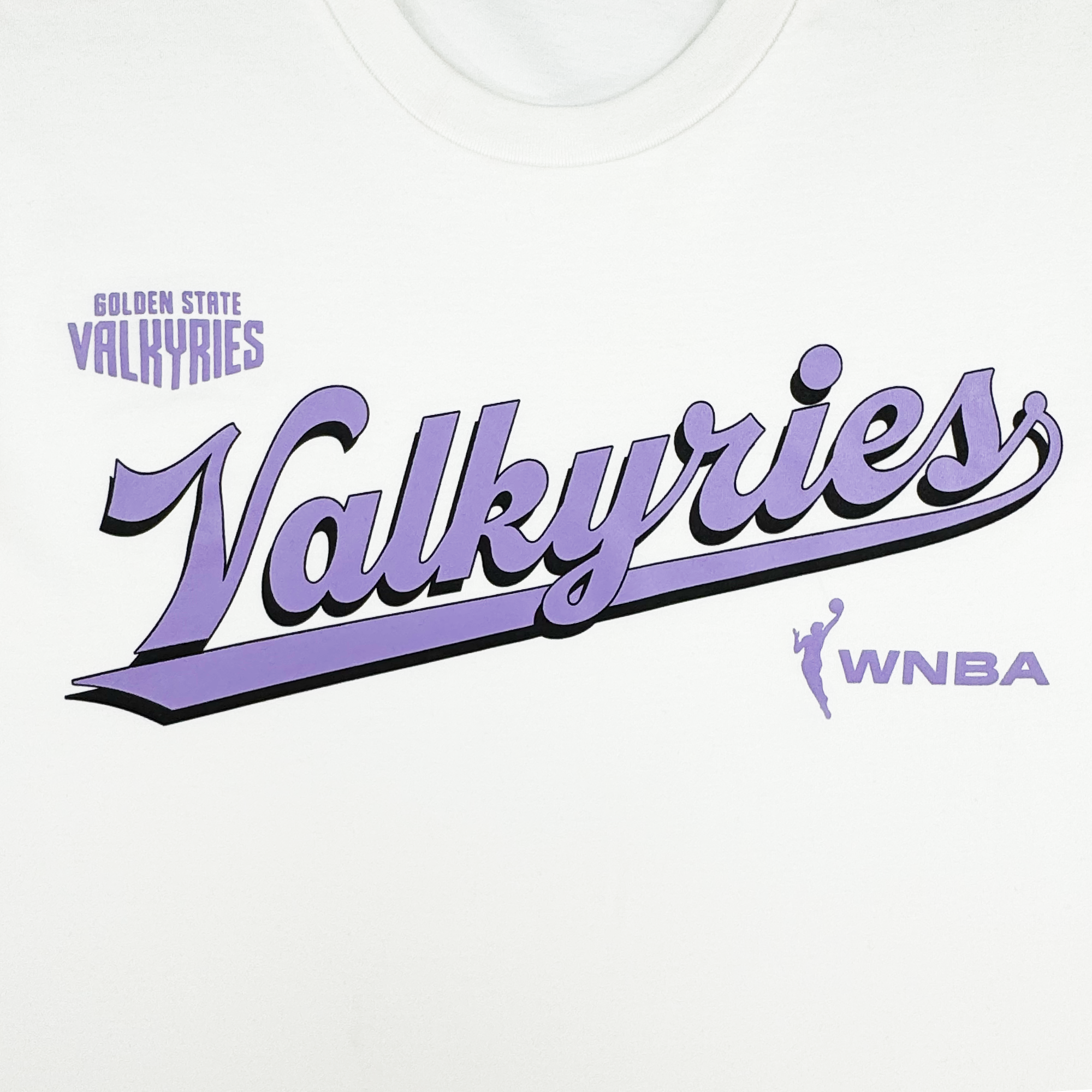 The GSV Golden State Valkyries Retro Script Tee is made from organic cotton and features "Golden State Valkyries" in purple above a large, cursive "Valkyries," accented by a purple WNBA logo and bold underline.