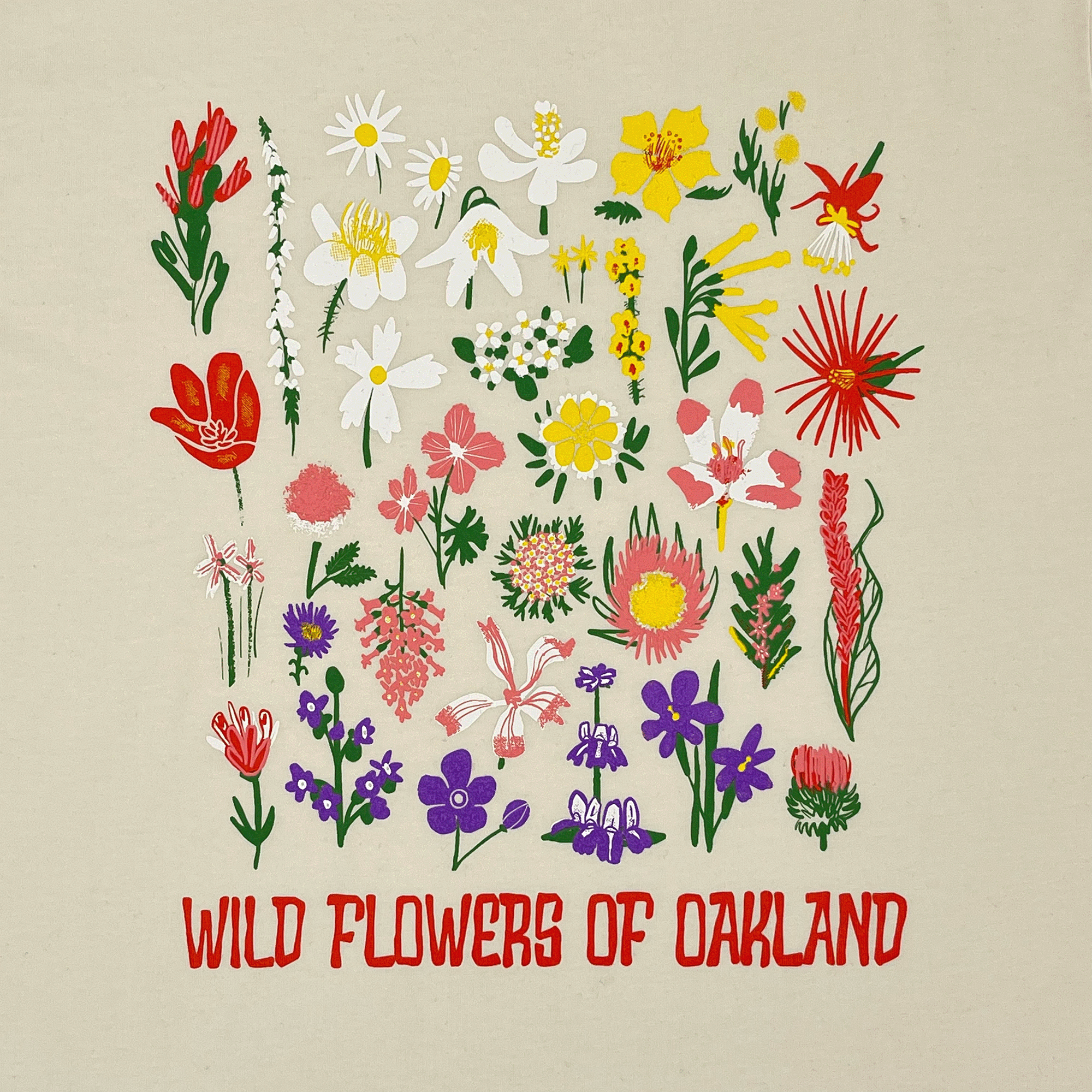 Close-up of graphic depicting various flowers captioned WILD FLOWERS OF OAKLAND on a natural cotton-colored women’s cut t-shirt.