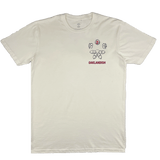 Front view of a natural cotton t-shirt with small Oaklandish worldwide graphic on the left chest wear side.