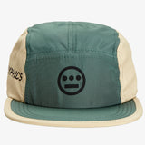 Close-up of front of baseball cap with olive green crown and khaki sides with Hieroglyphics logo on crown.