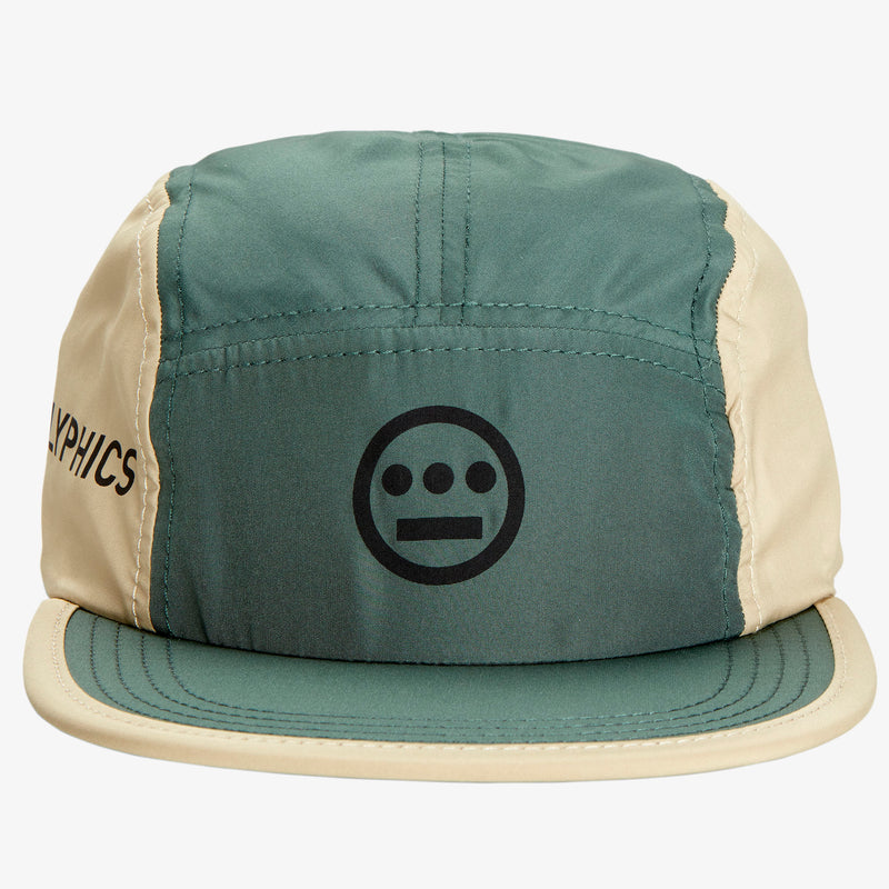 Close-up of front of baseball cap with olive green crown and khaki sides with Hieroglyphics logo on crown.